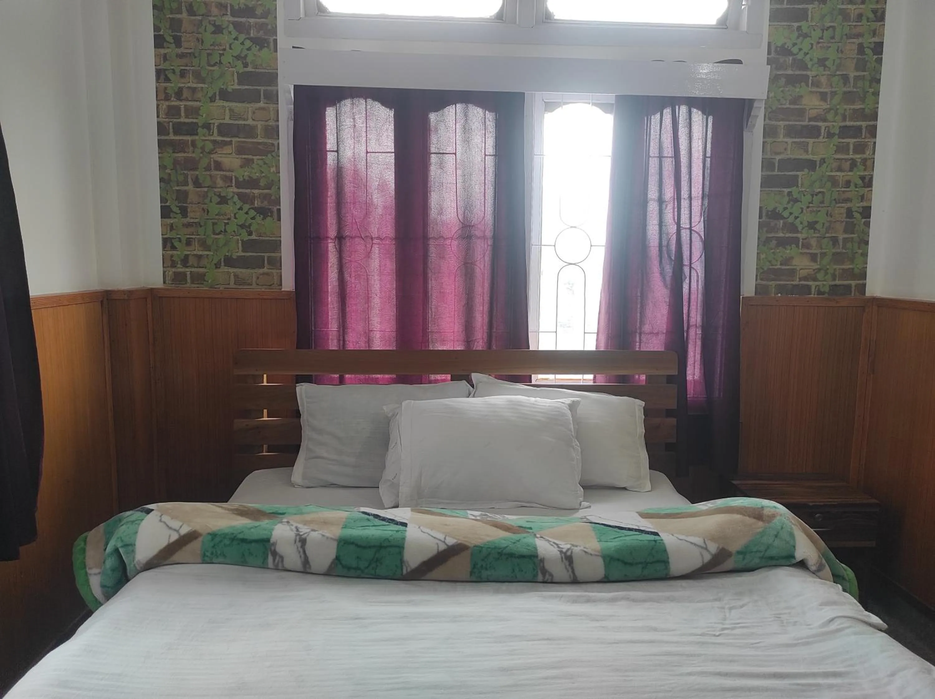 Bed in Hotel Tawang Regency