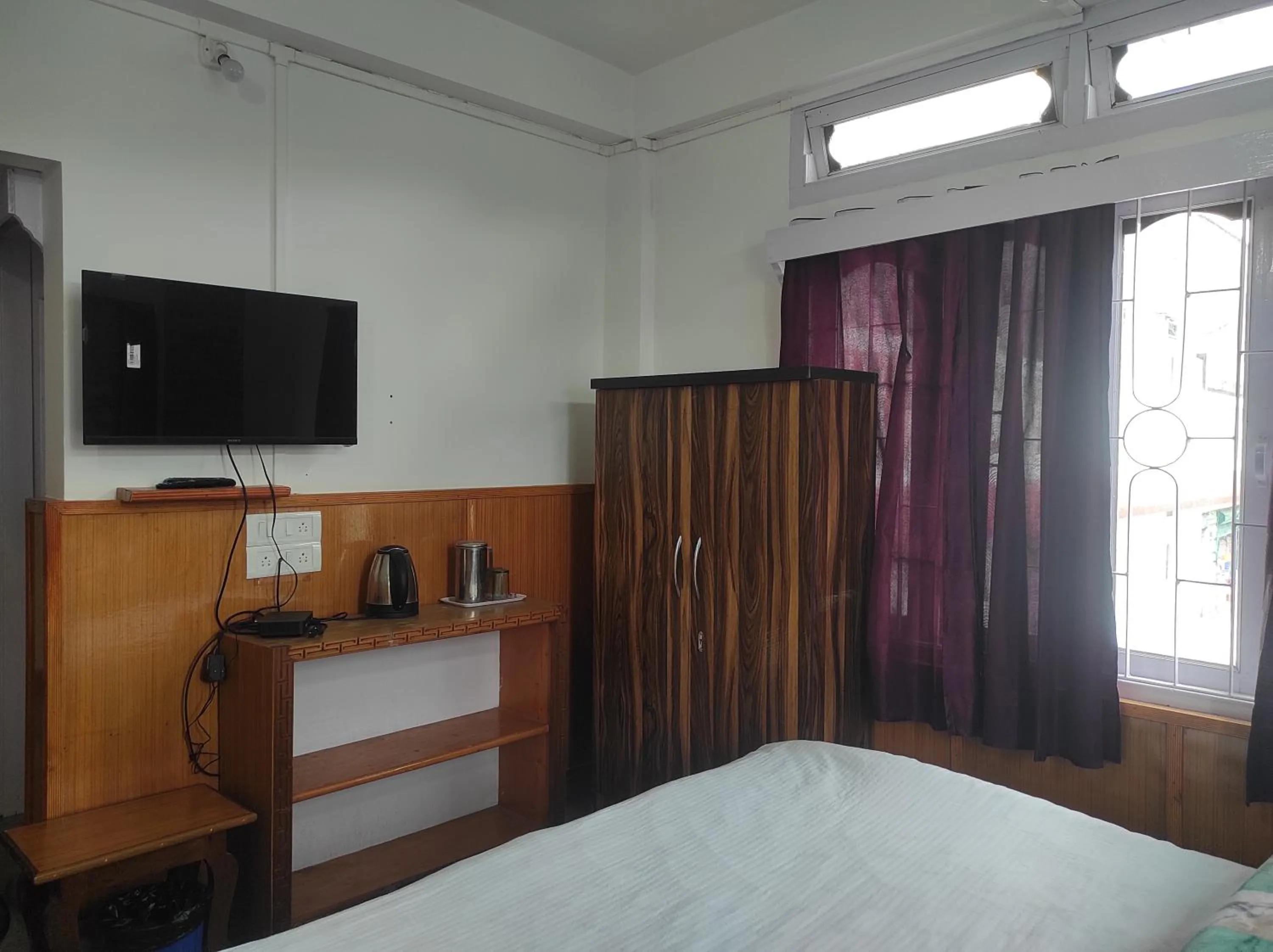 Bed in Hotel Tawang Regency