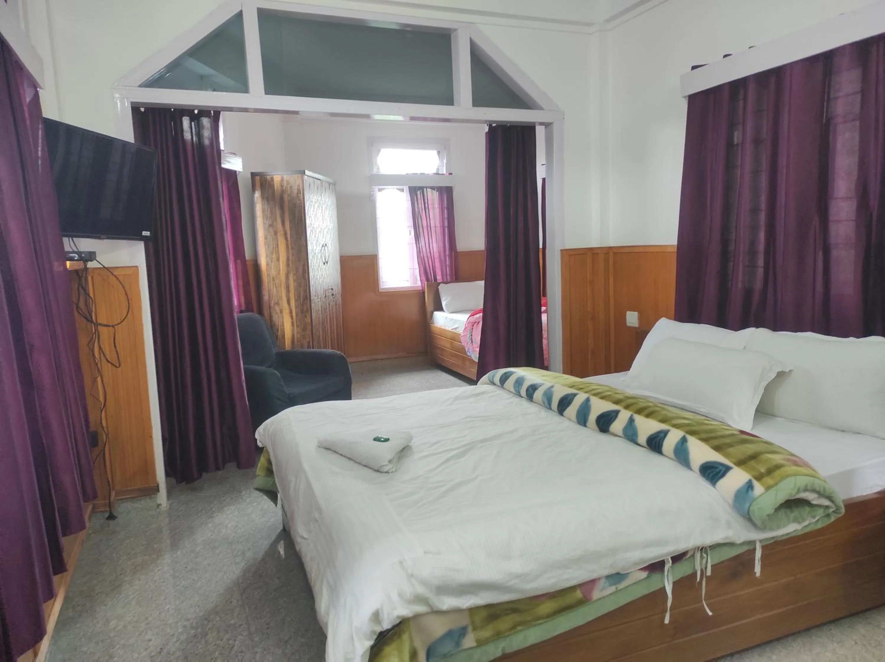 Bed in Hotel Tawang Regency