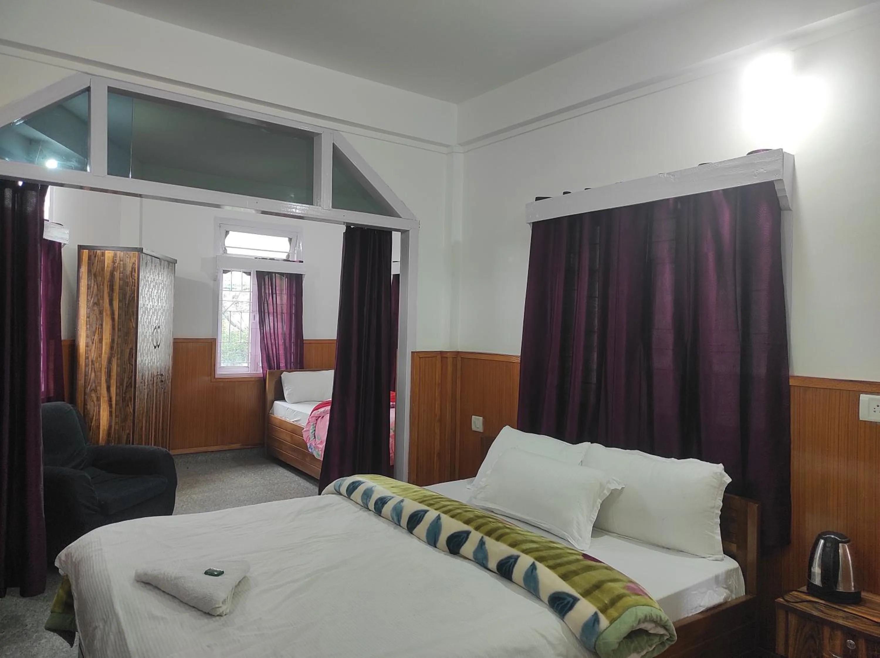 Bed in Hotel Tawang Regency
