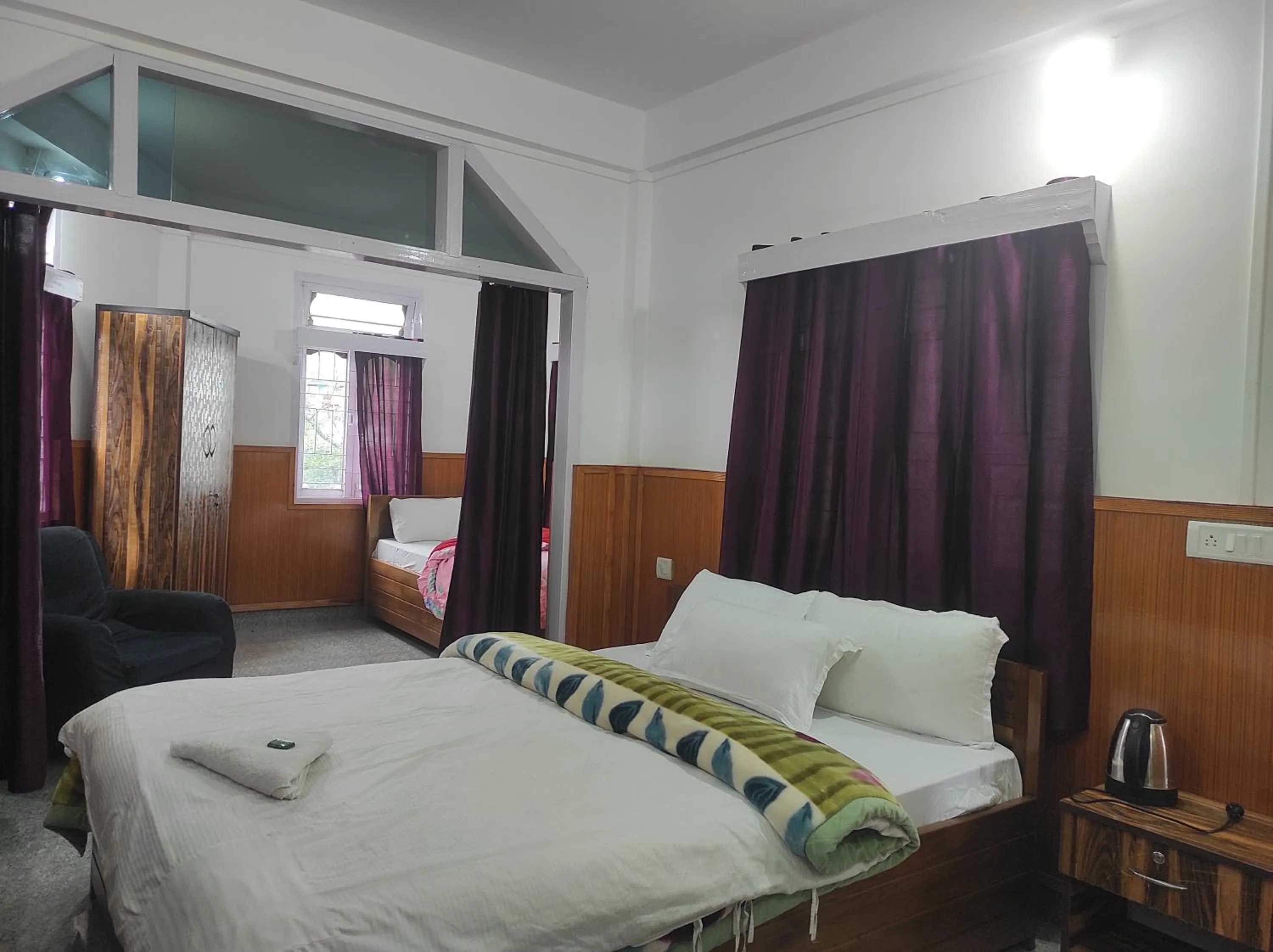 Bed in Hotel Tawang Regency