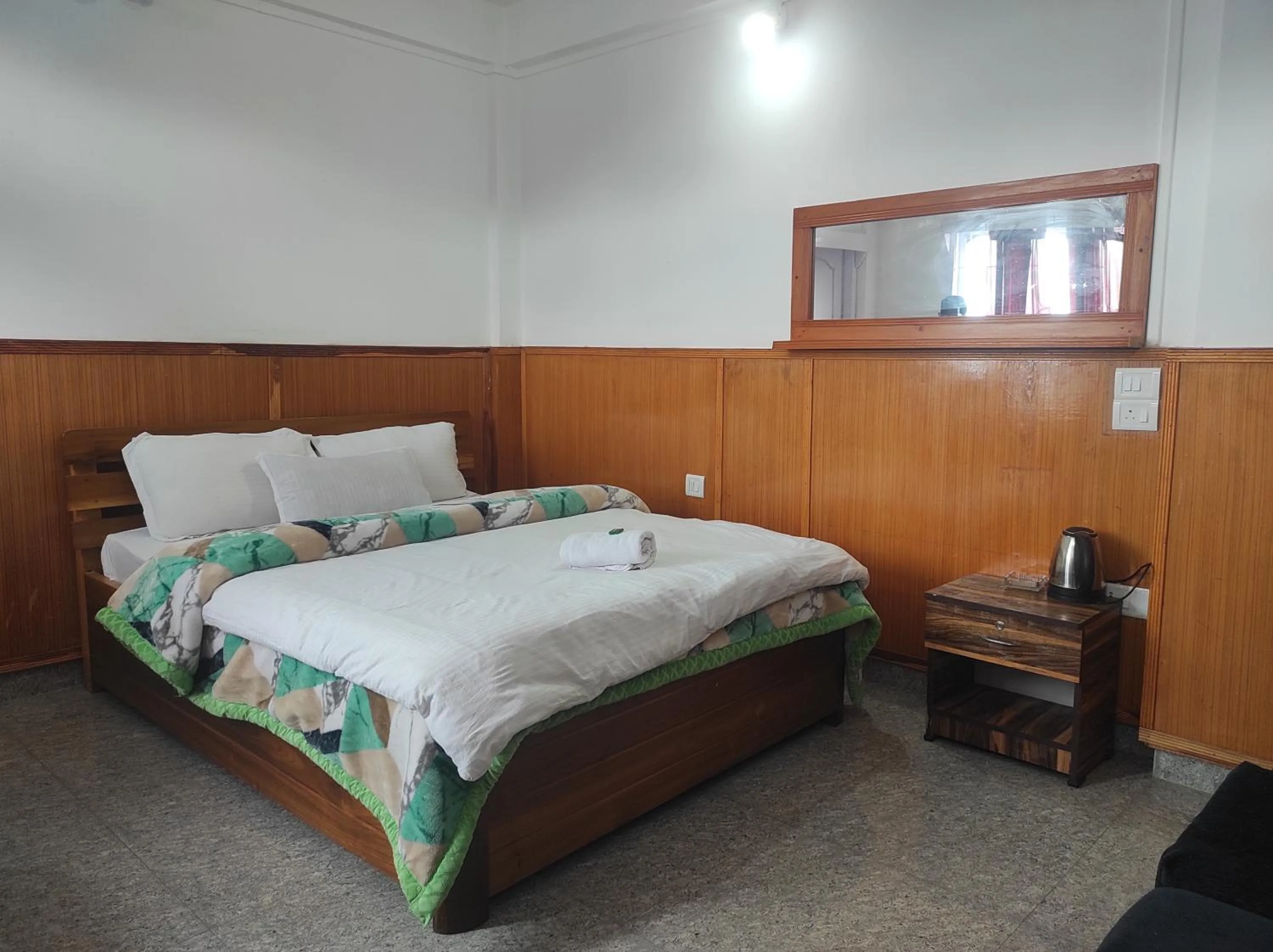 Bed in Hotel Tawang Regency