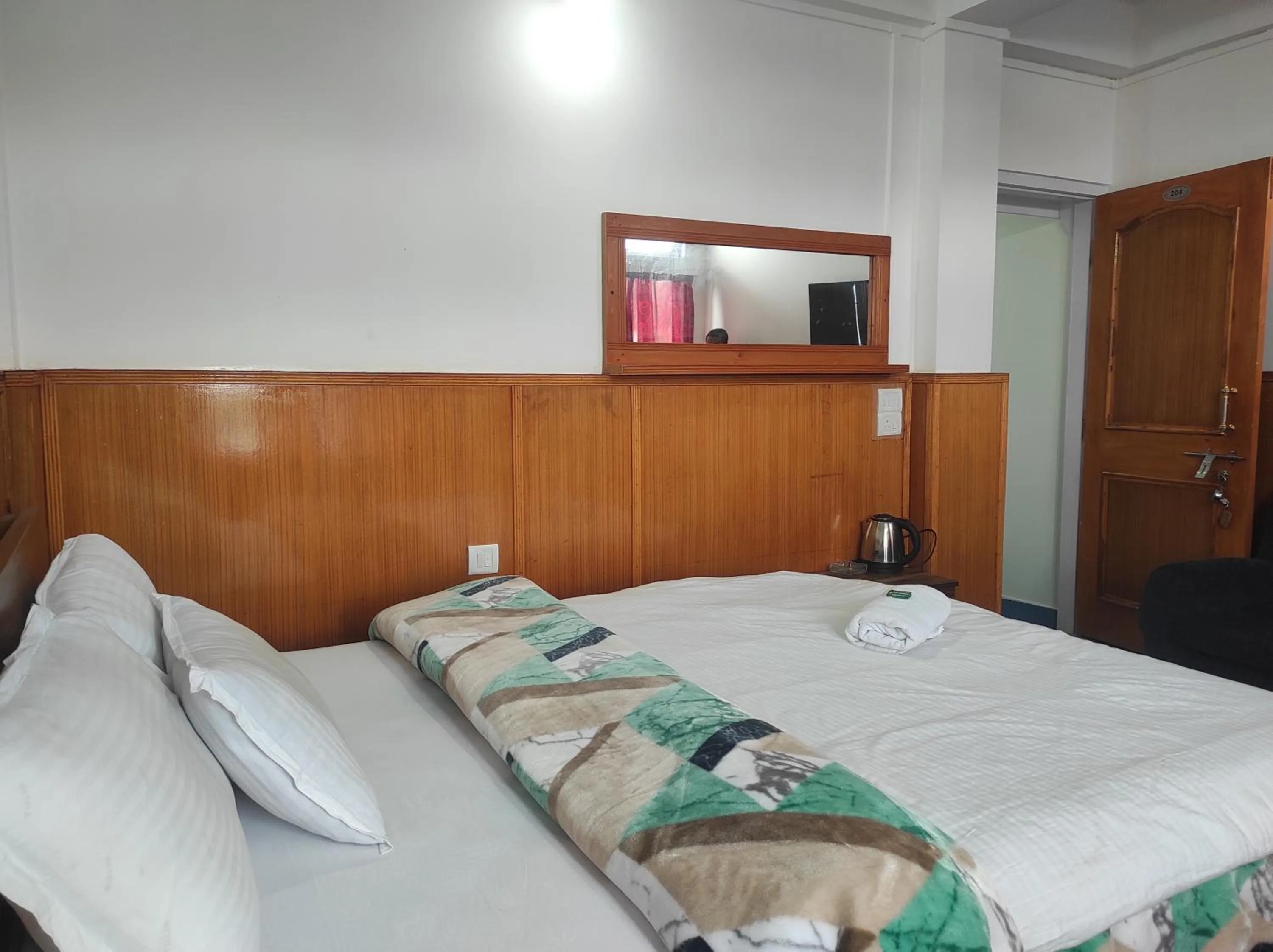 Bed in Hotel Tawang Regency