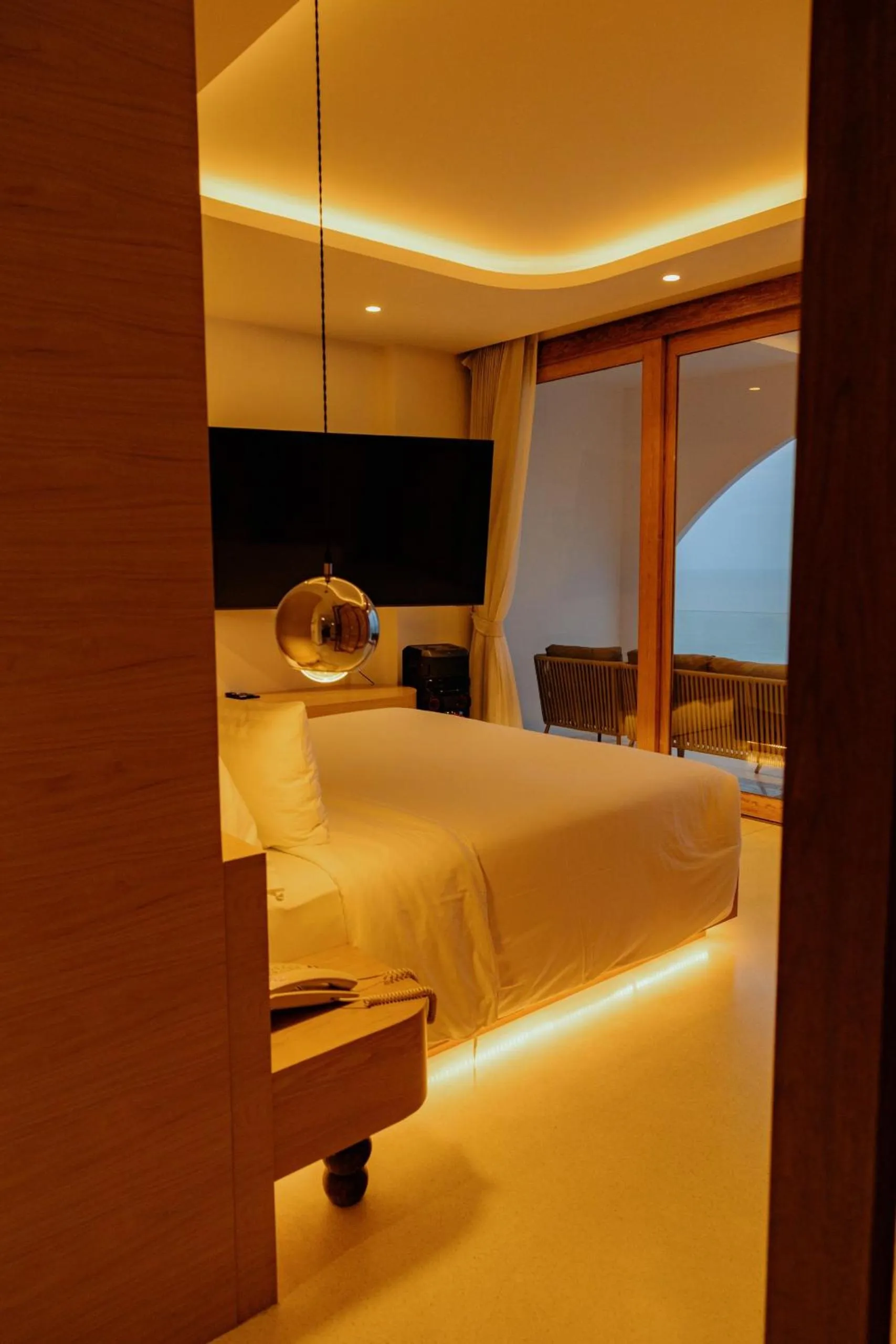 Bed in Elite Atoll Beachfront Hotel