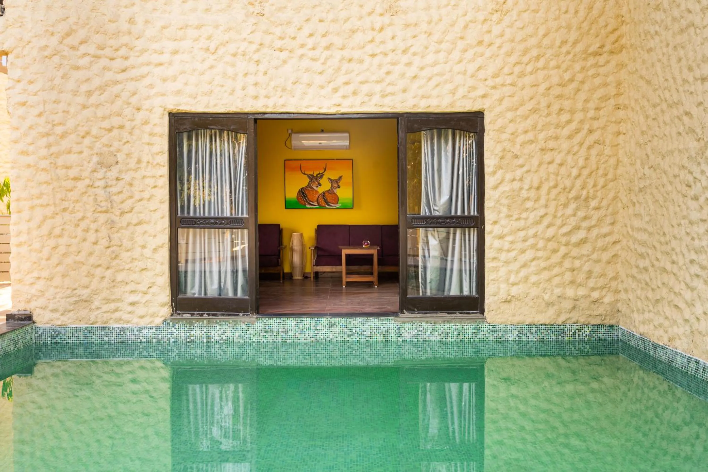 Swimming pool in Citrus Prime Kanha Resort and Villas