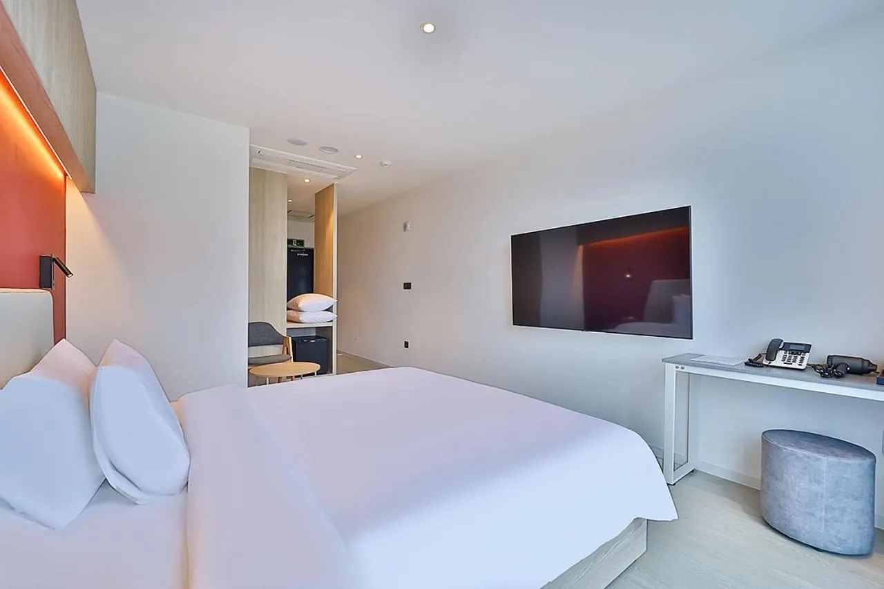 Bed in Browndot Signature Hotel