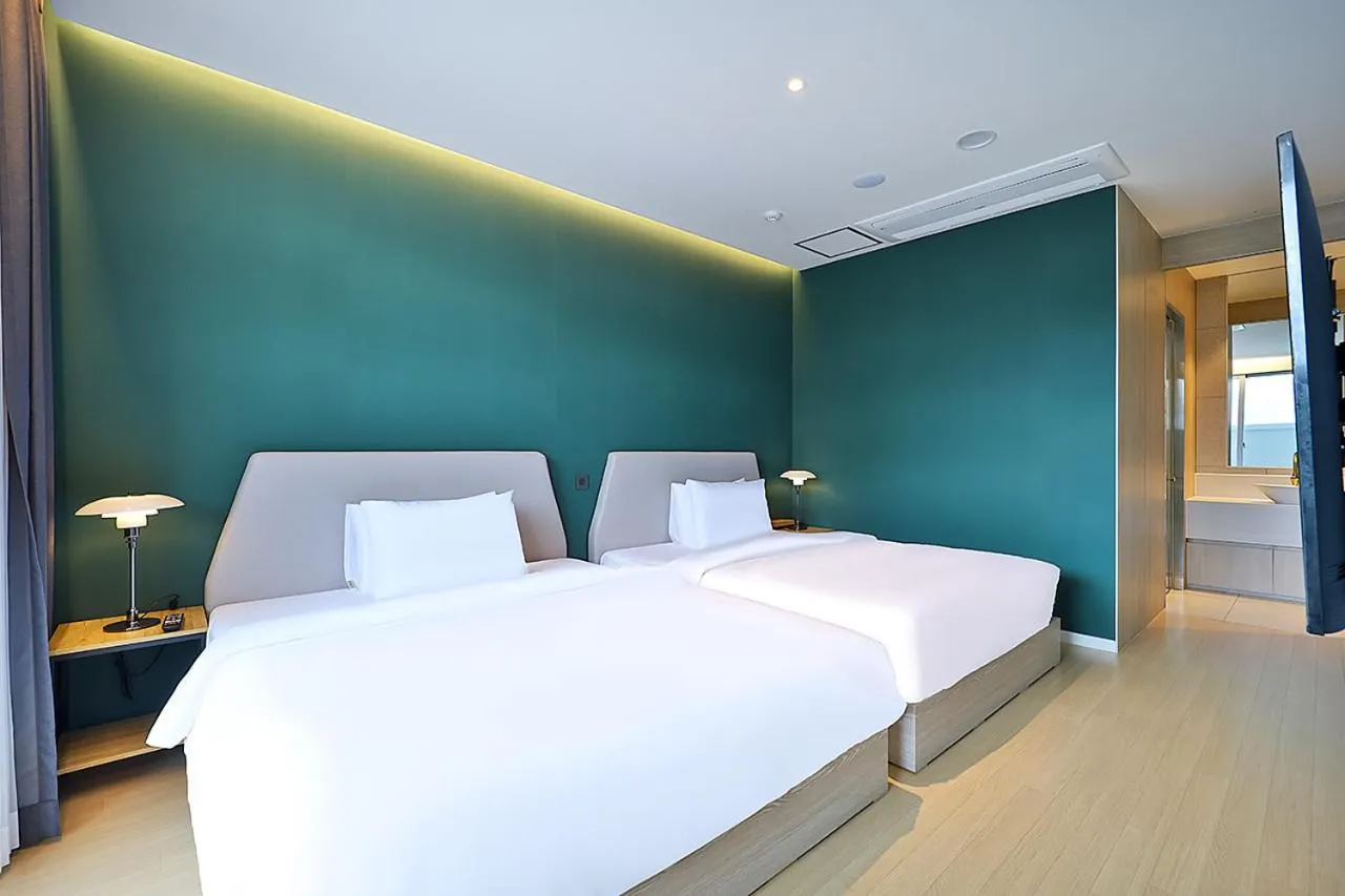 Bed in Browndot Signature Hotel