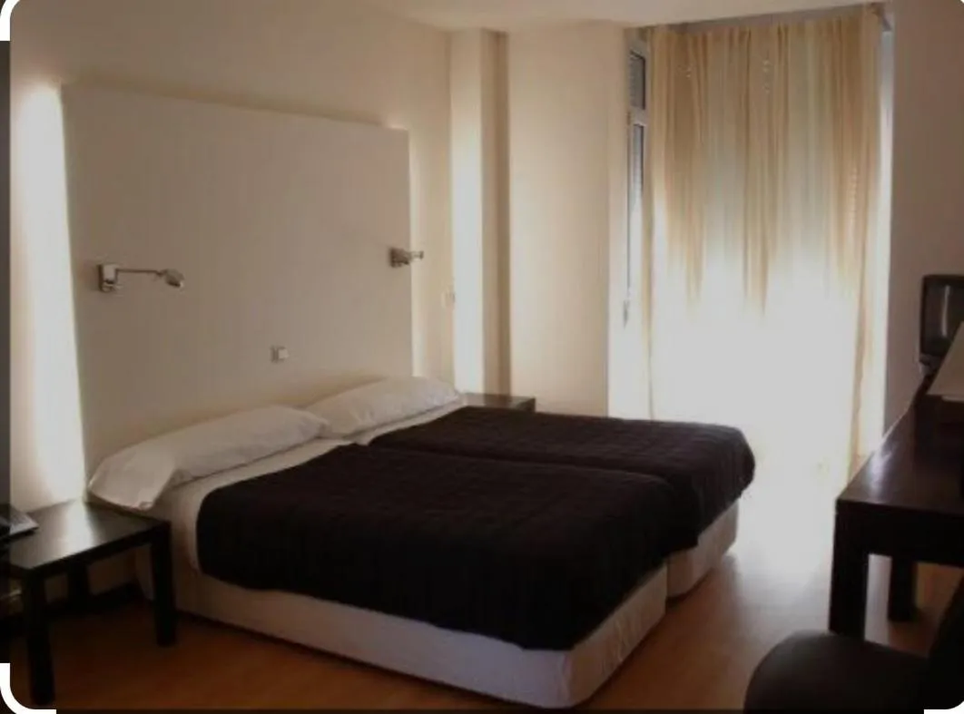 Bed in hotel asador versus