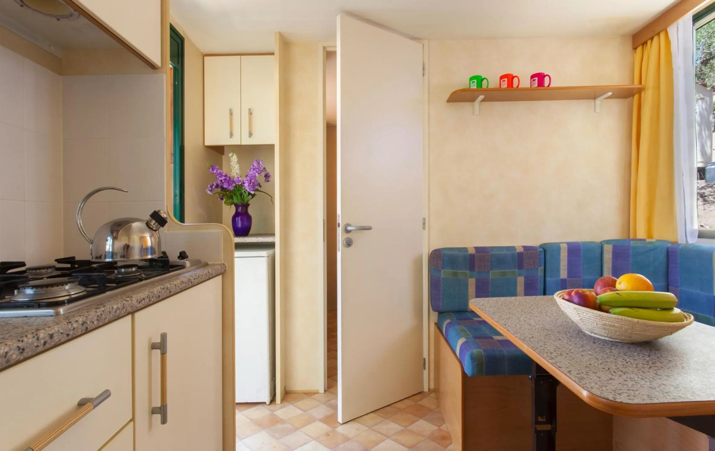 Kitchen or kitchenette in Camping Village Capo D'Orso