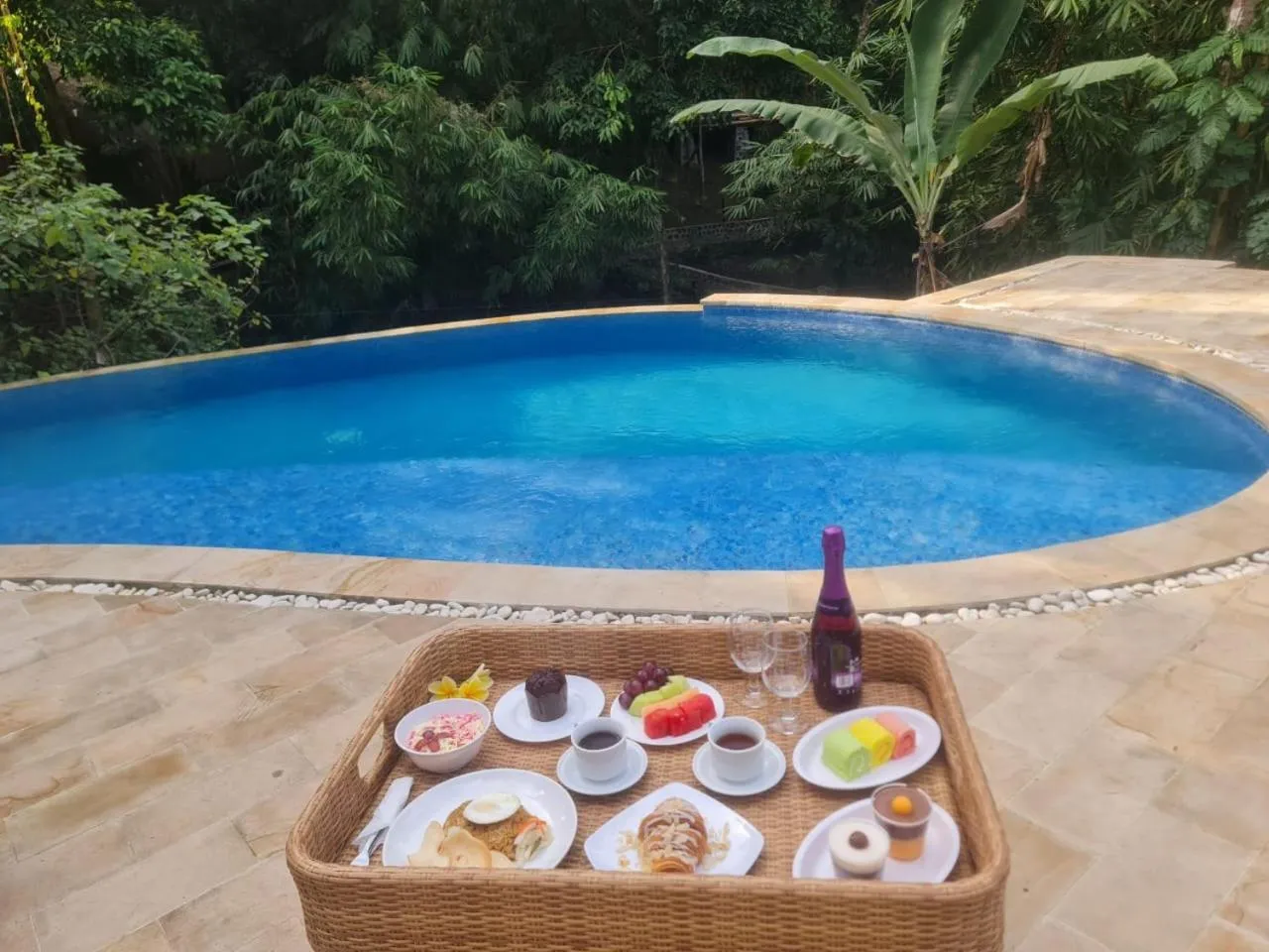 Swimming pool in The Osing Bamboo Resort - a LIBERTA Collection