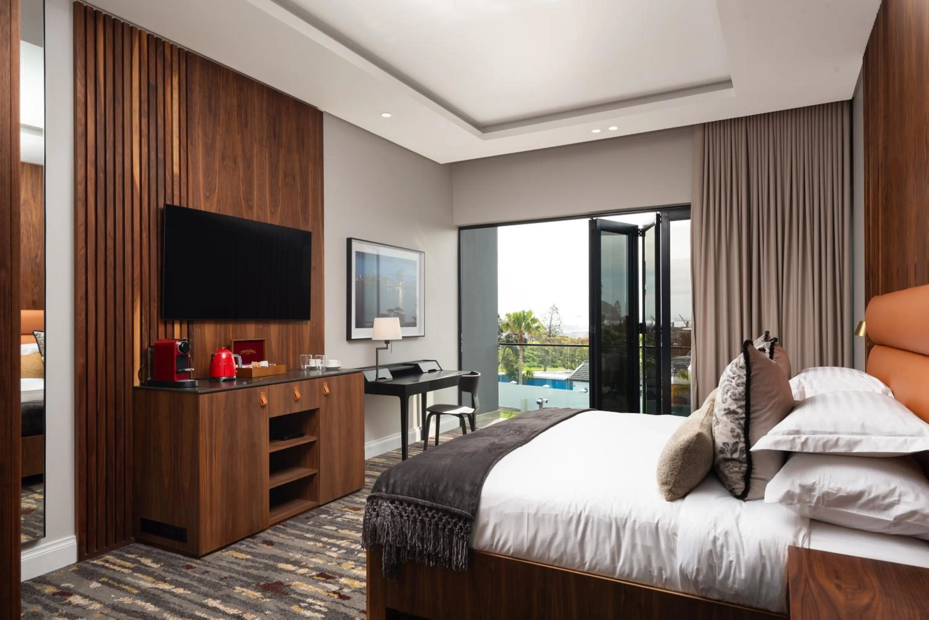 Communal lounge/ TV room in Anfani Boutique Hotel