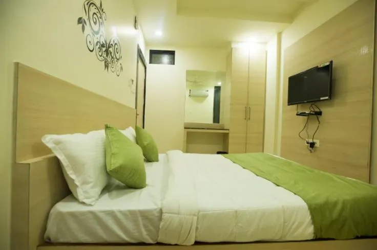 Photo of the whole room, Bed in Hotel Raj Residency