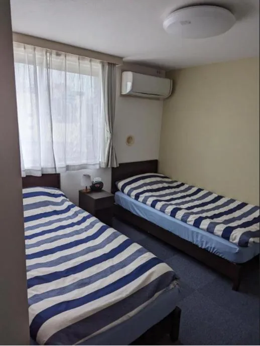 Bed in Hotel Yuni Star-Club