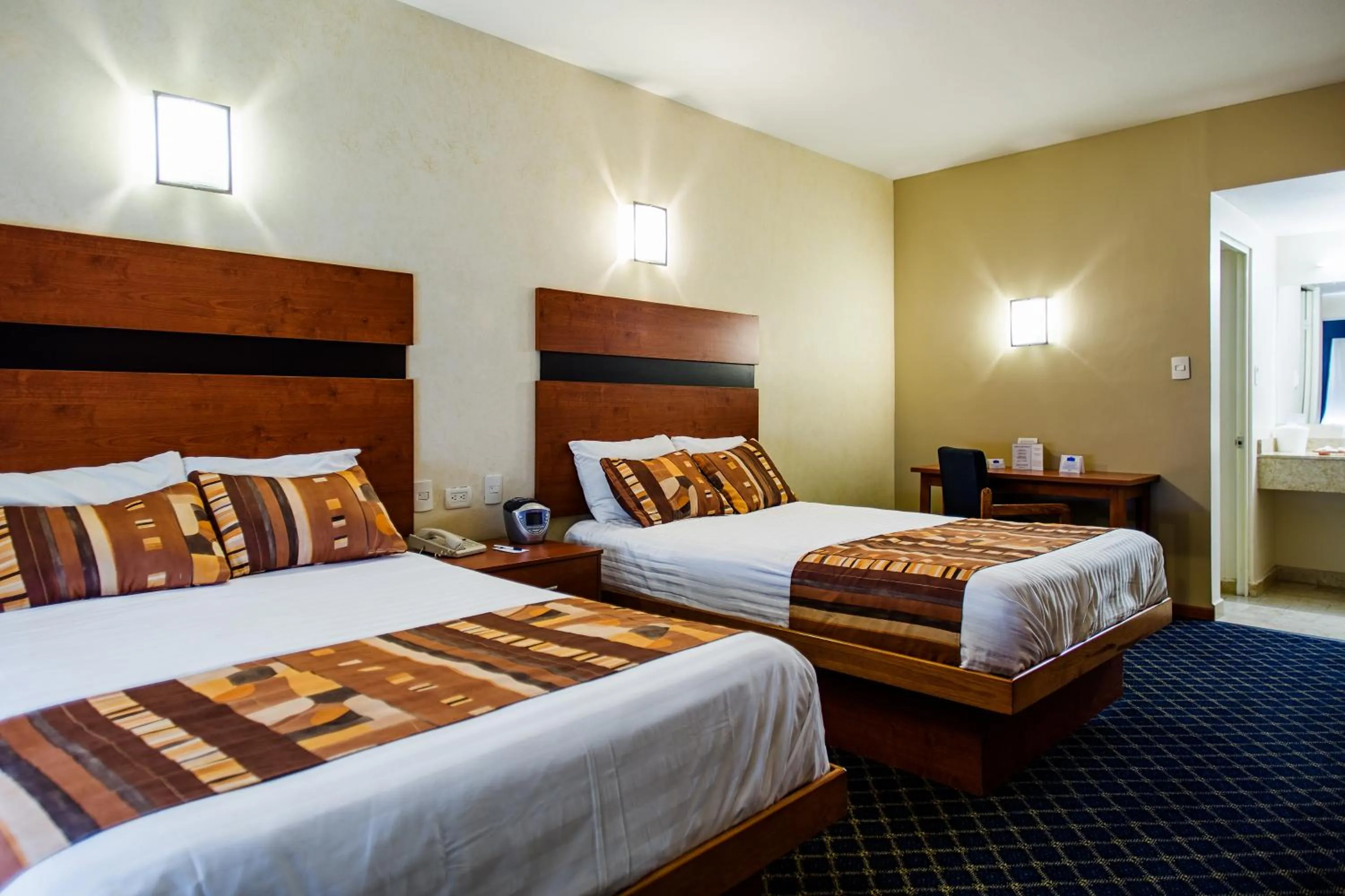 Property building, Bed in American Inn Hotel & Suites Delicias