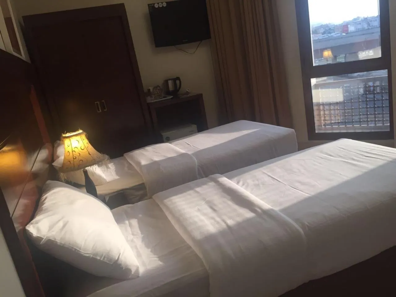 Bed in Manazel Alaswaf Hotel