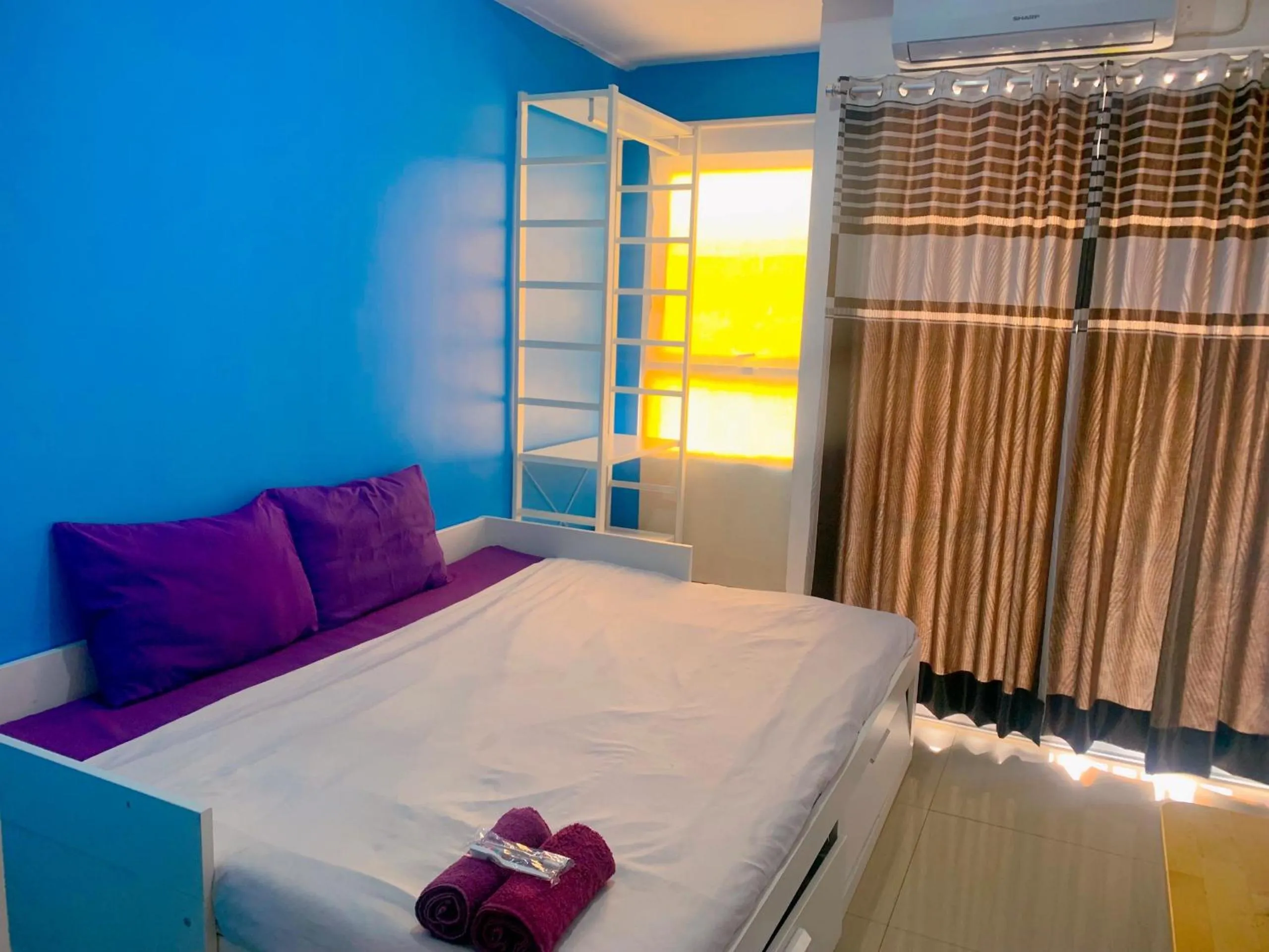 Bedroom in Apartemen Poris 88 by Benchmark