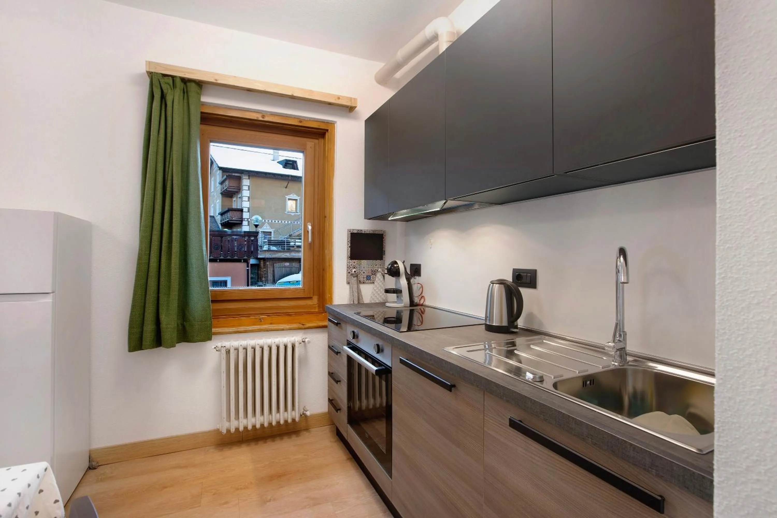 Kitchen or kitchenette in Appartamento Arlecchino Livigno