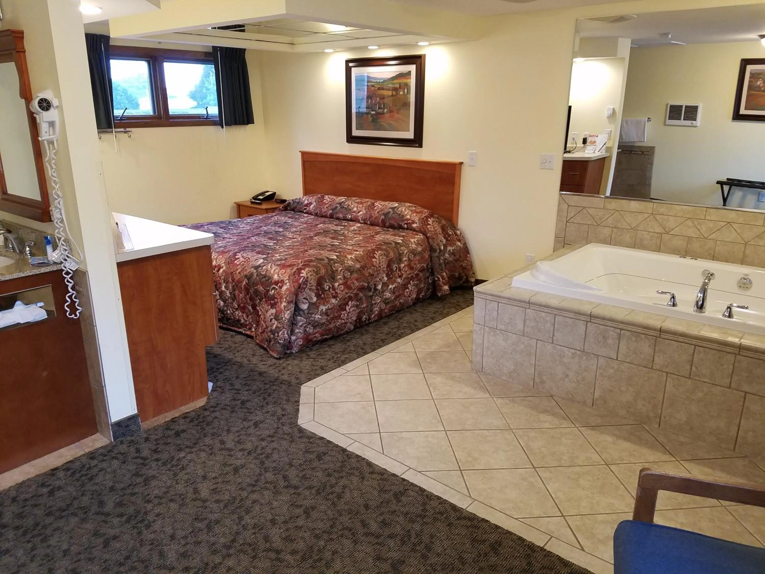 Bed in Black Hawk Motel & Suites