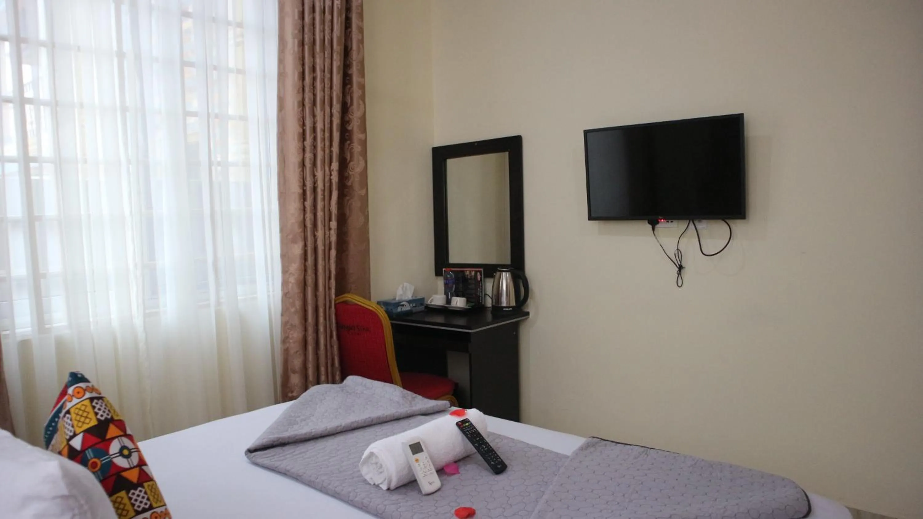 Bed in Crystal Premier Hotel