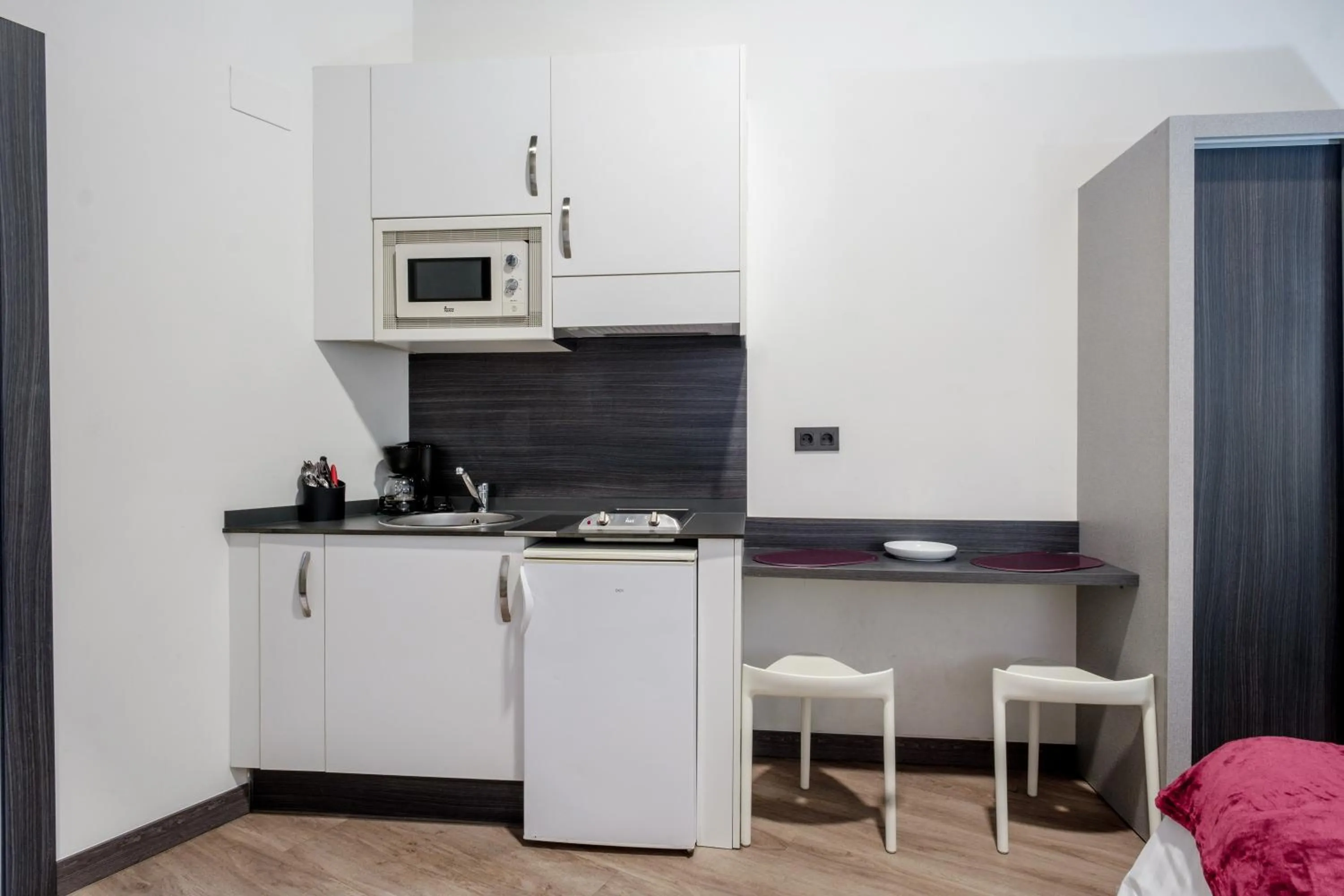 Kitchen or kitchenette in Apartamentos Capua