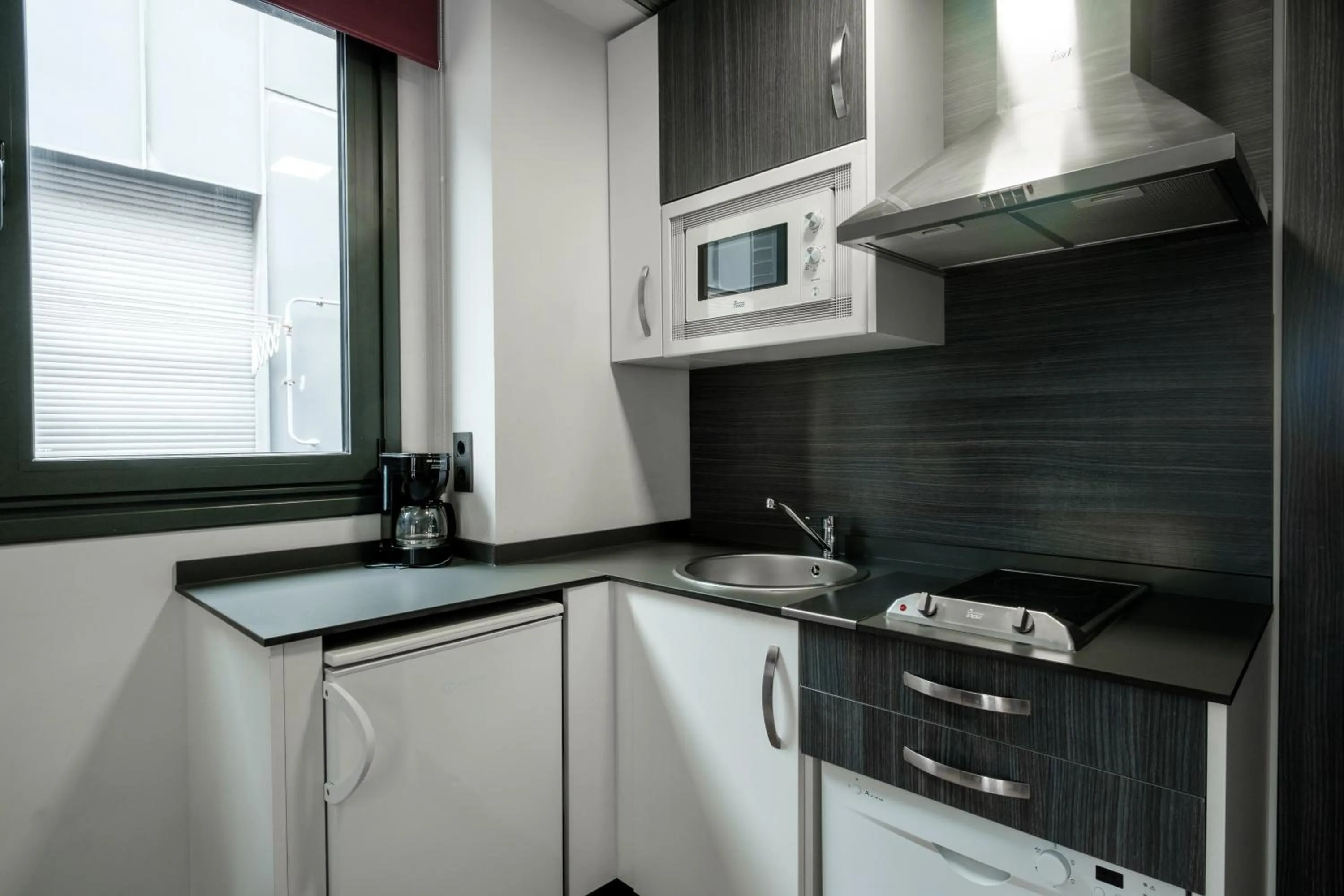 Kitchen or kitchenette in Apartamentos Capua