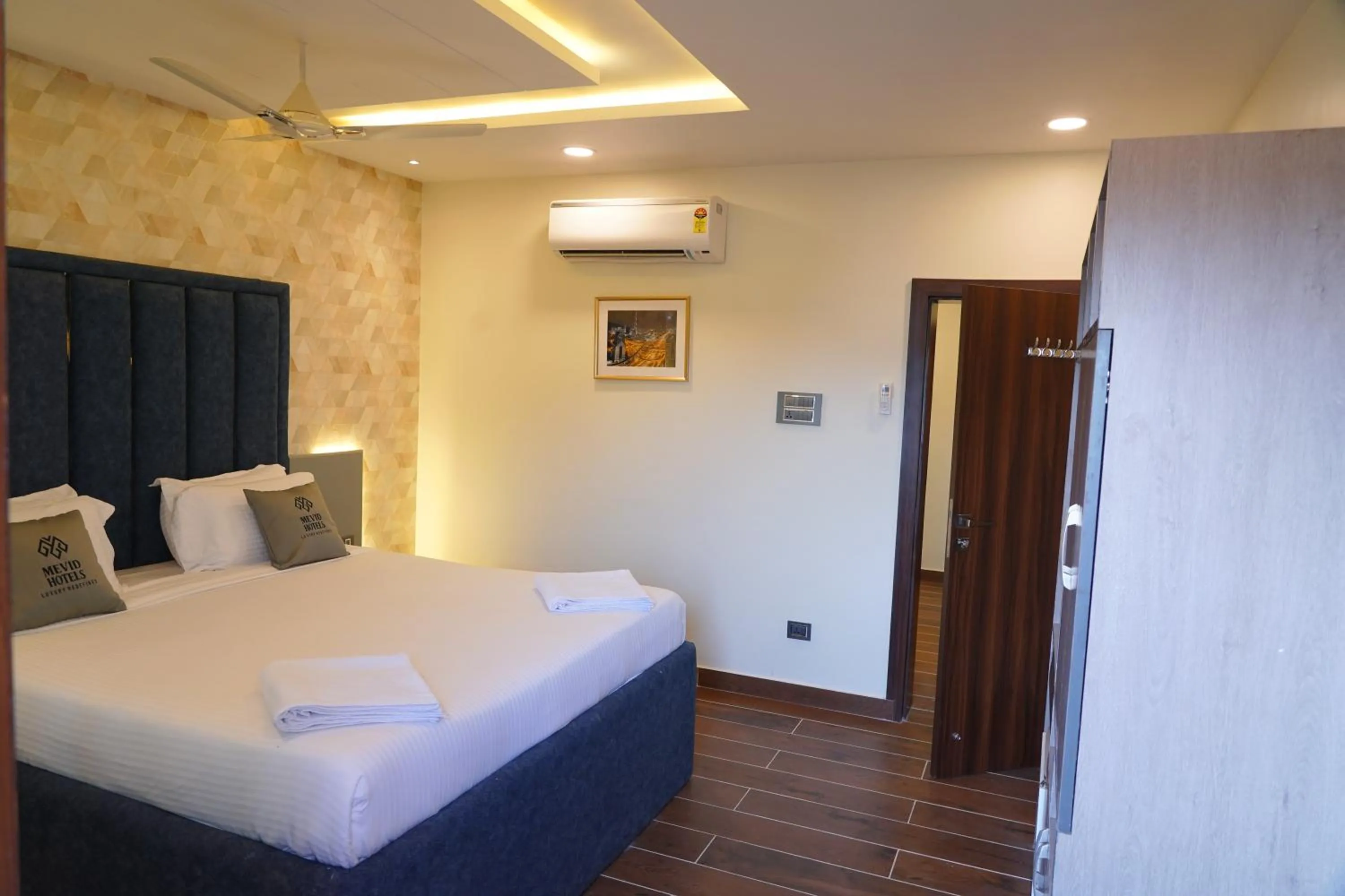 fireplace, Bed in Mevid Hotels