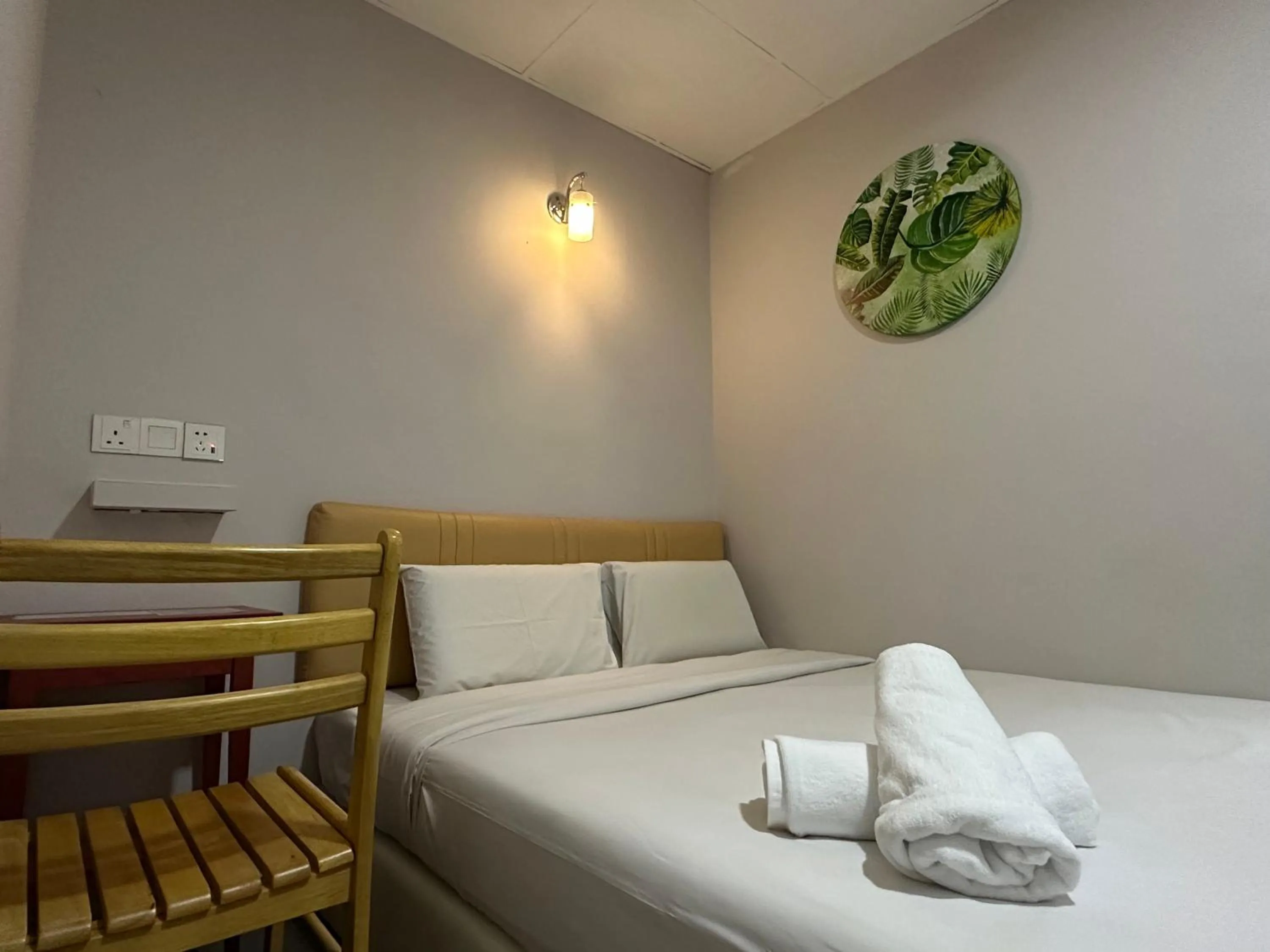 Bed in Dingdong Homes Hotel