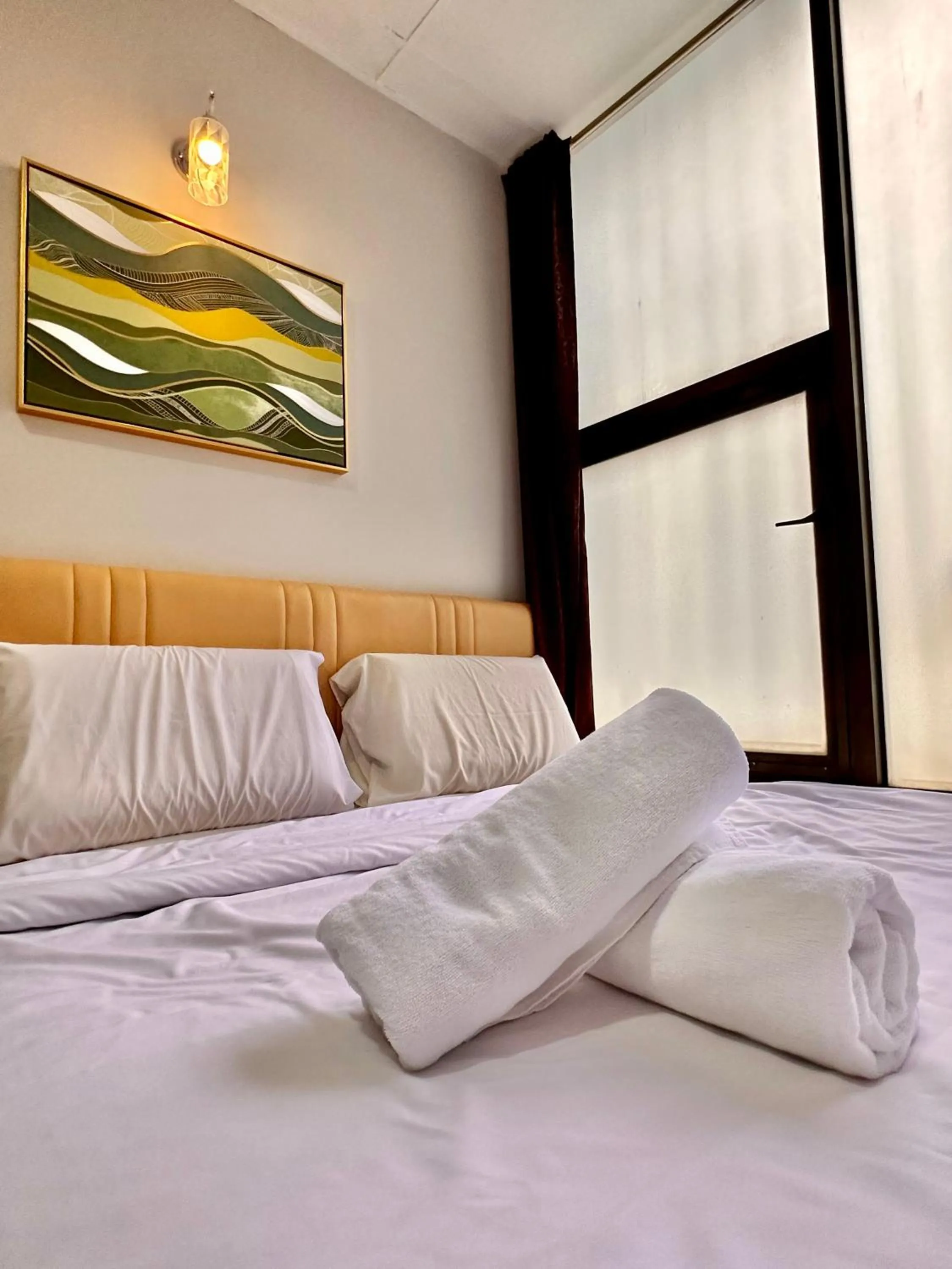 Bed in Dingdong Homes Hotel