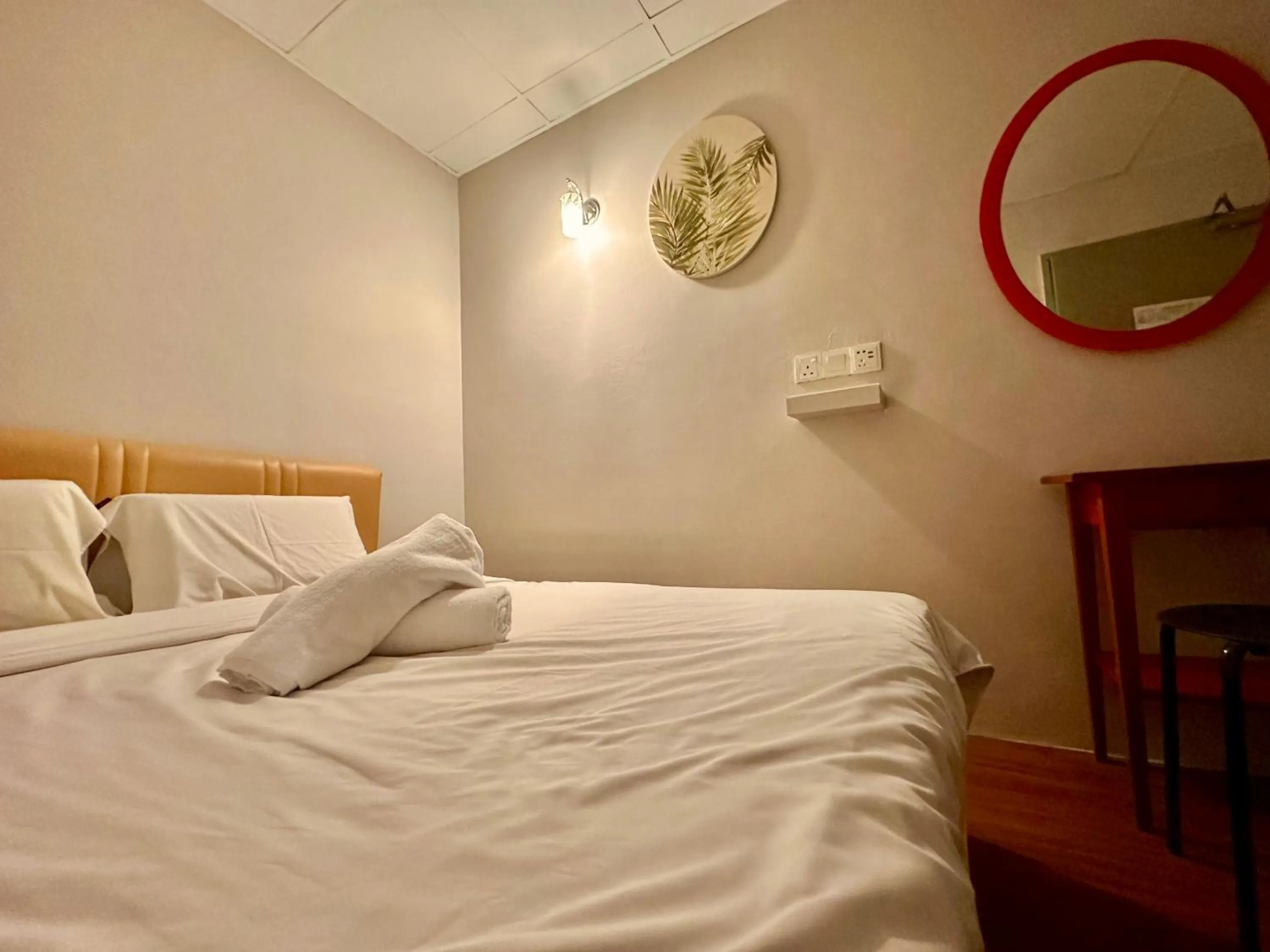 Bed in Dingdong Homes Hotel