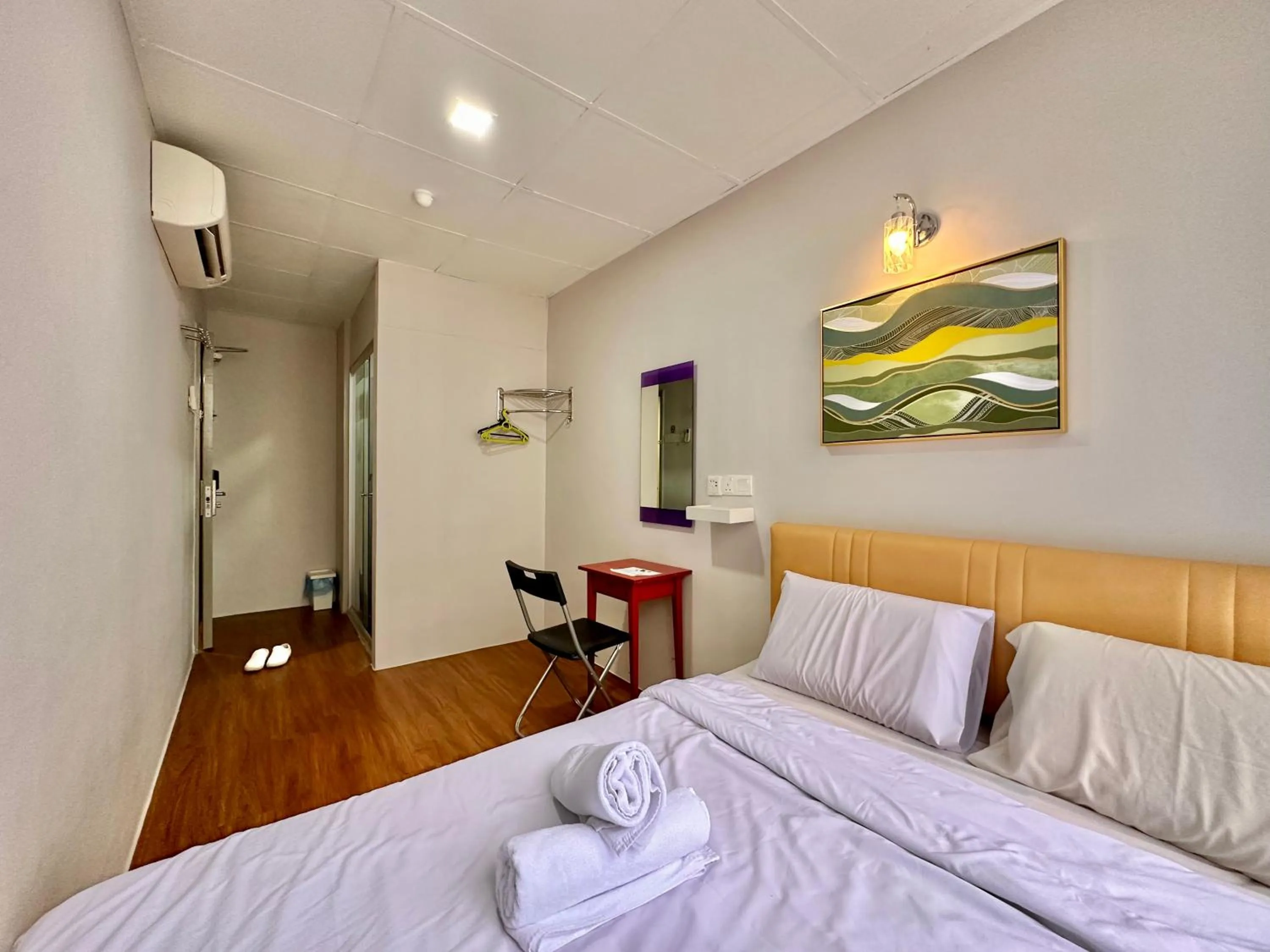 Bed in Dingdong Homes Hotel