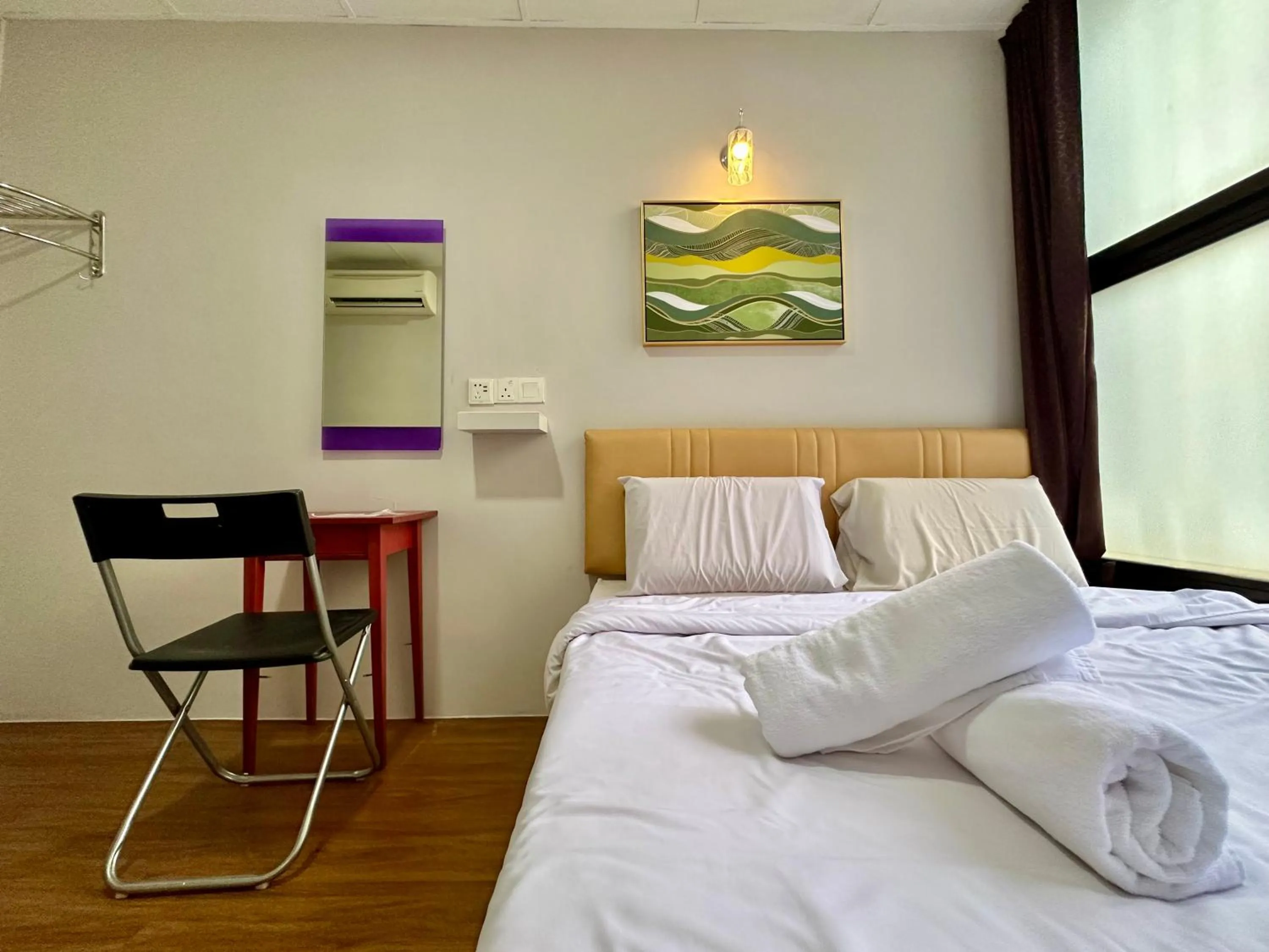 Bed in Dingdong Homes Hotel