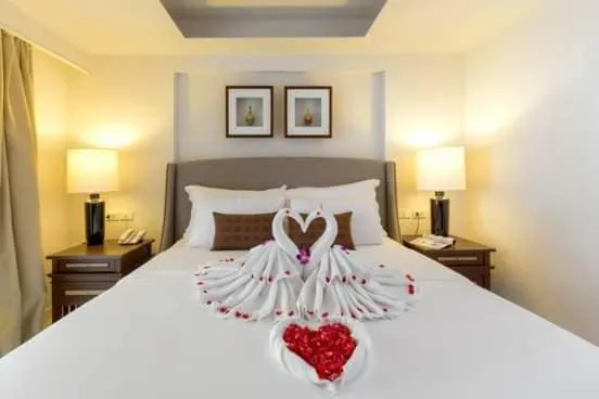 Bed in THE TOP PATONG RESORT.