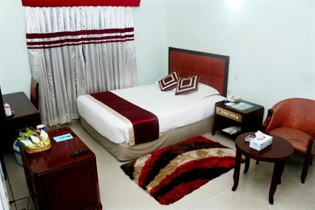 Bed in Meridian Hotel & Restaurant