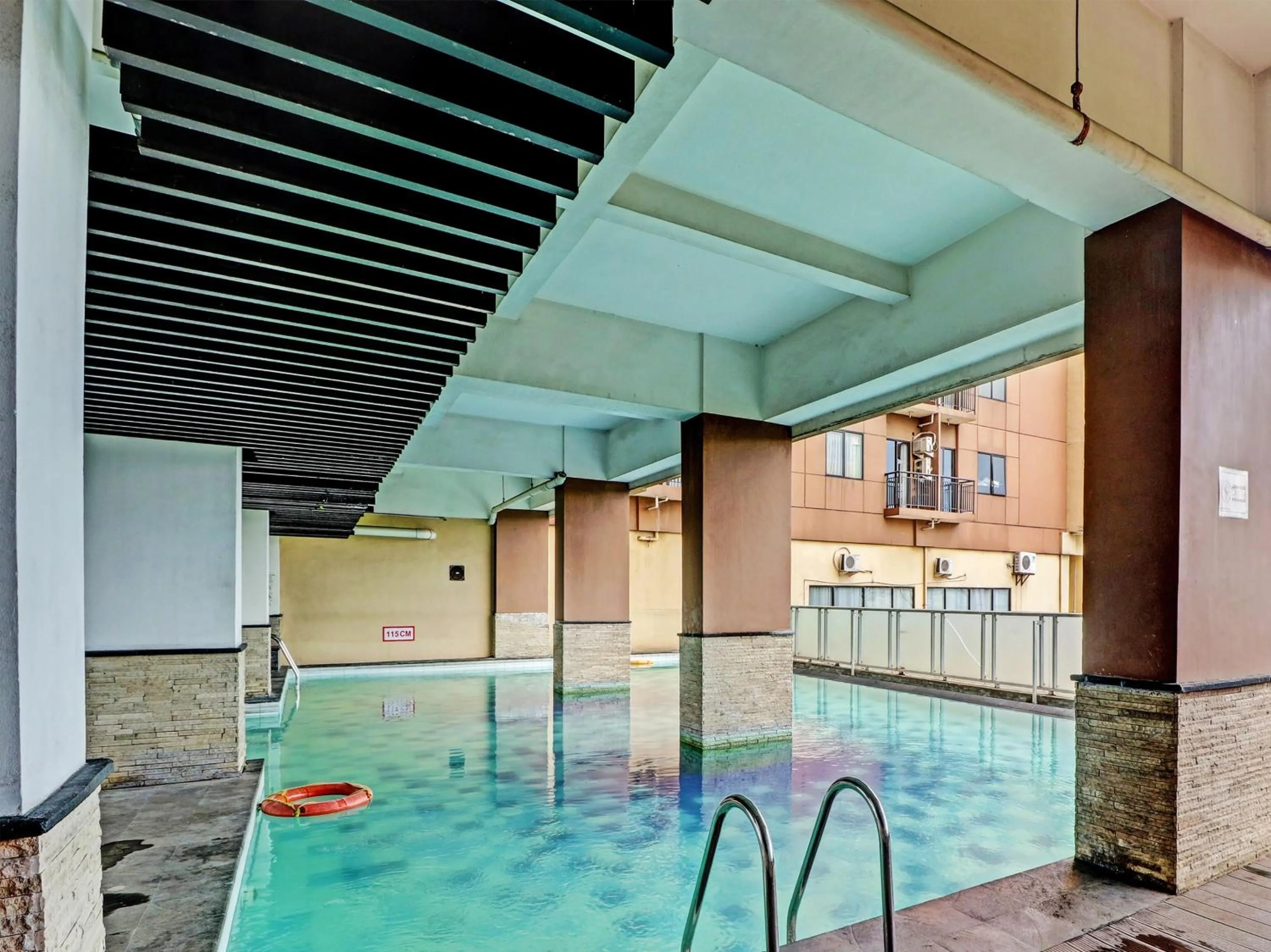 Swimming pool in OYO Life 92735 Apartemen Tamansari Panoramic By Santuy