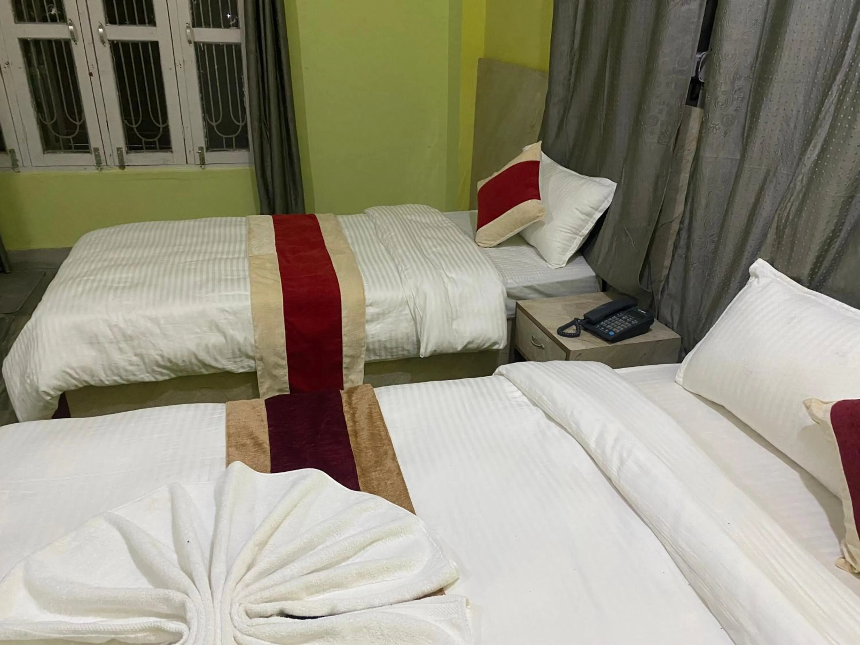 Bed in Hotel Kavya Inn