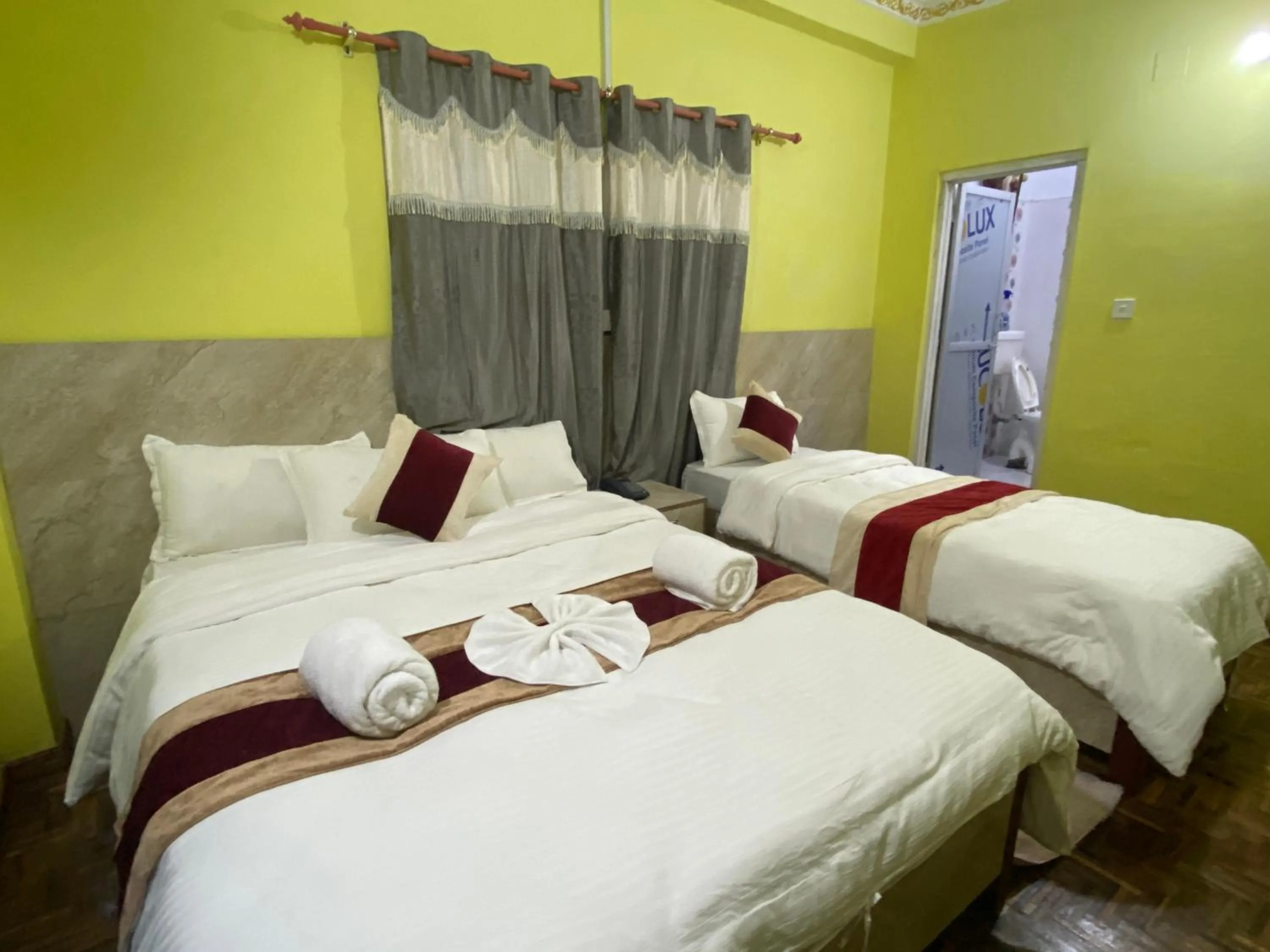 Bed in Hotel Kavya Inn