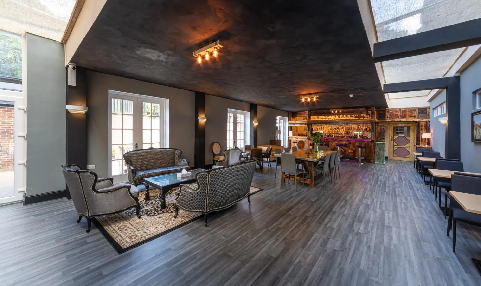 Communal lounge/ TV room in The French Partridge,