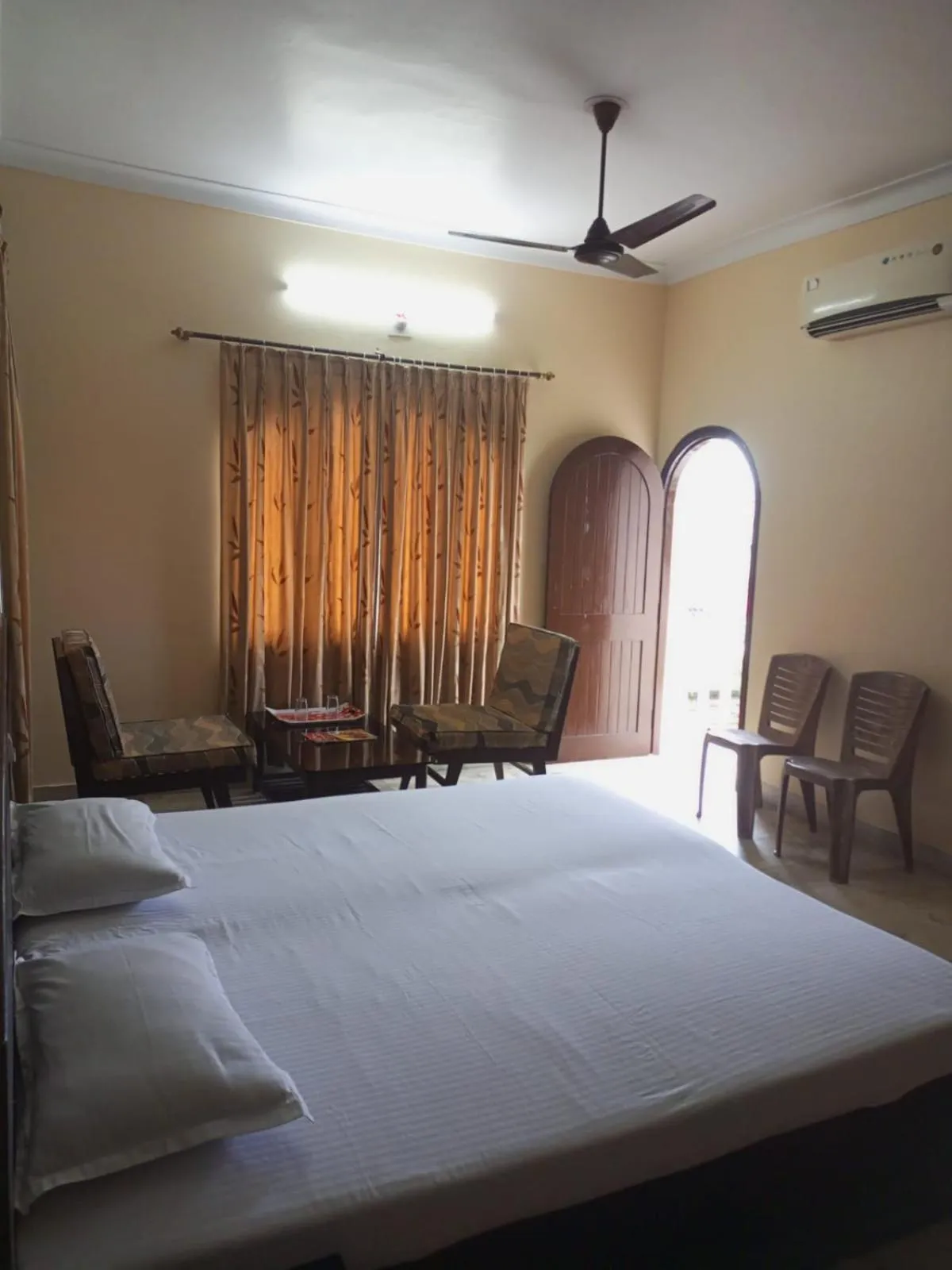 Photo of the whole room, Bed in MADHUR RESIDENCY