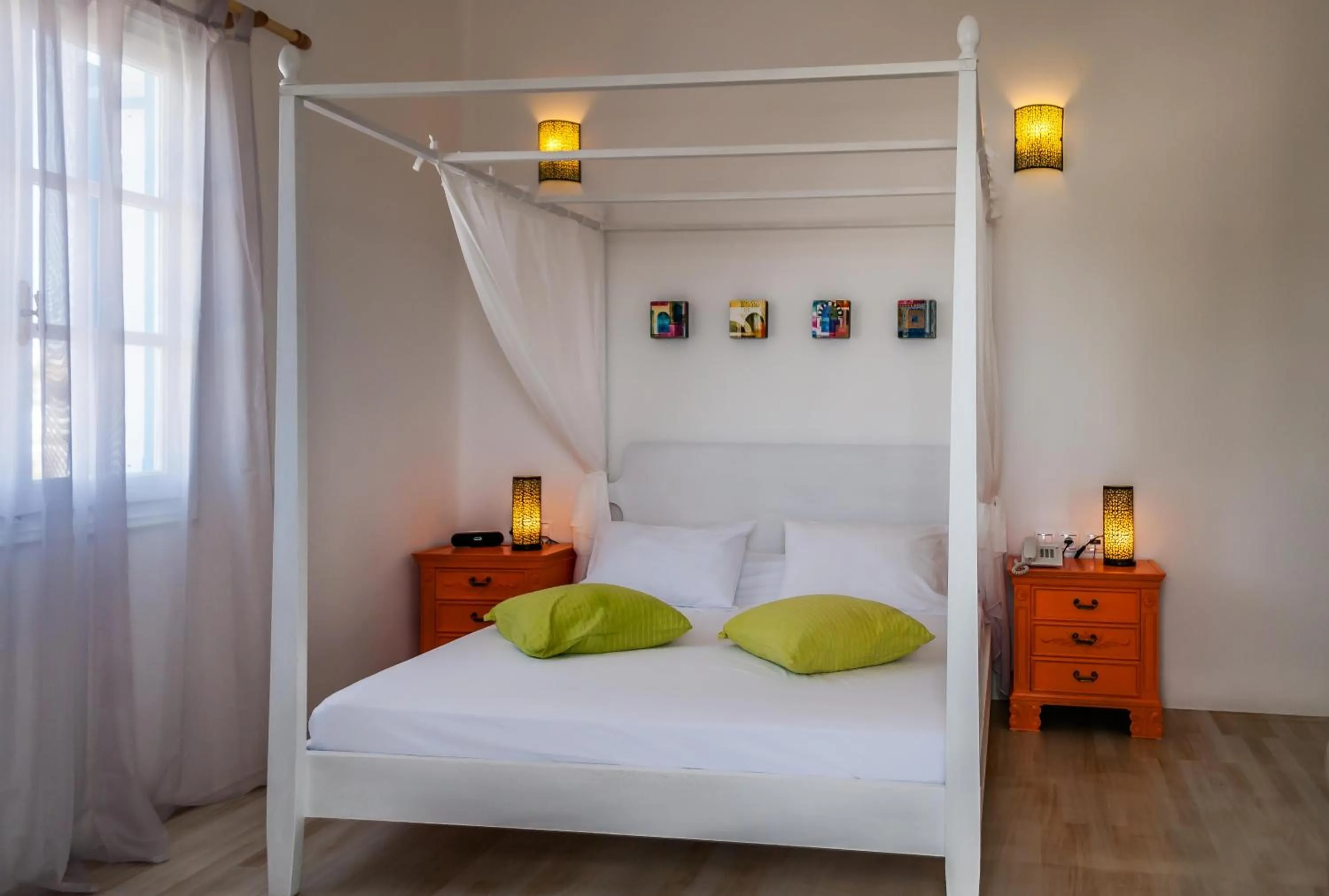 Bed in Eiriana Luxury Suites