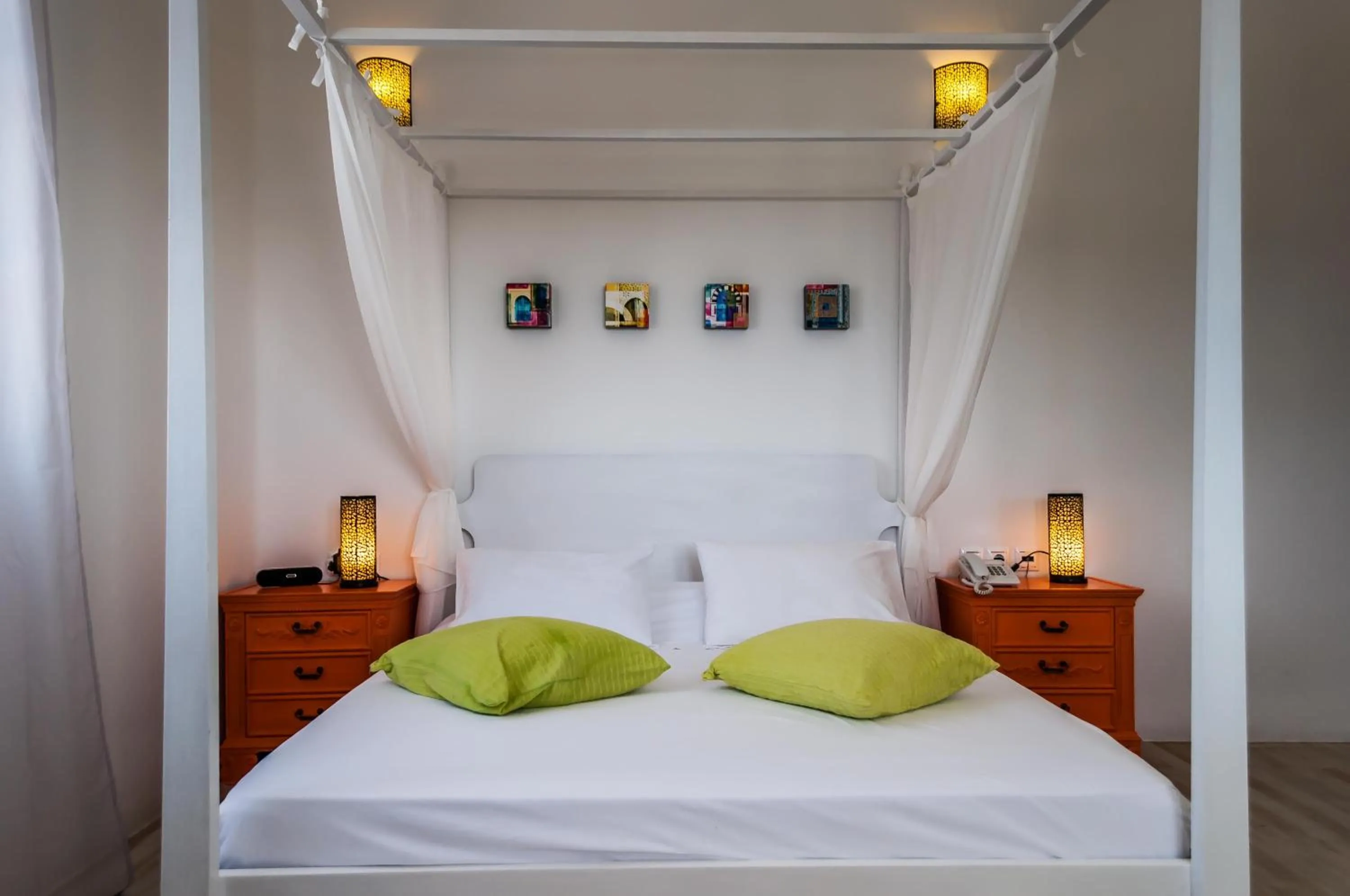 Bed in Eiriana Luxury Suites