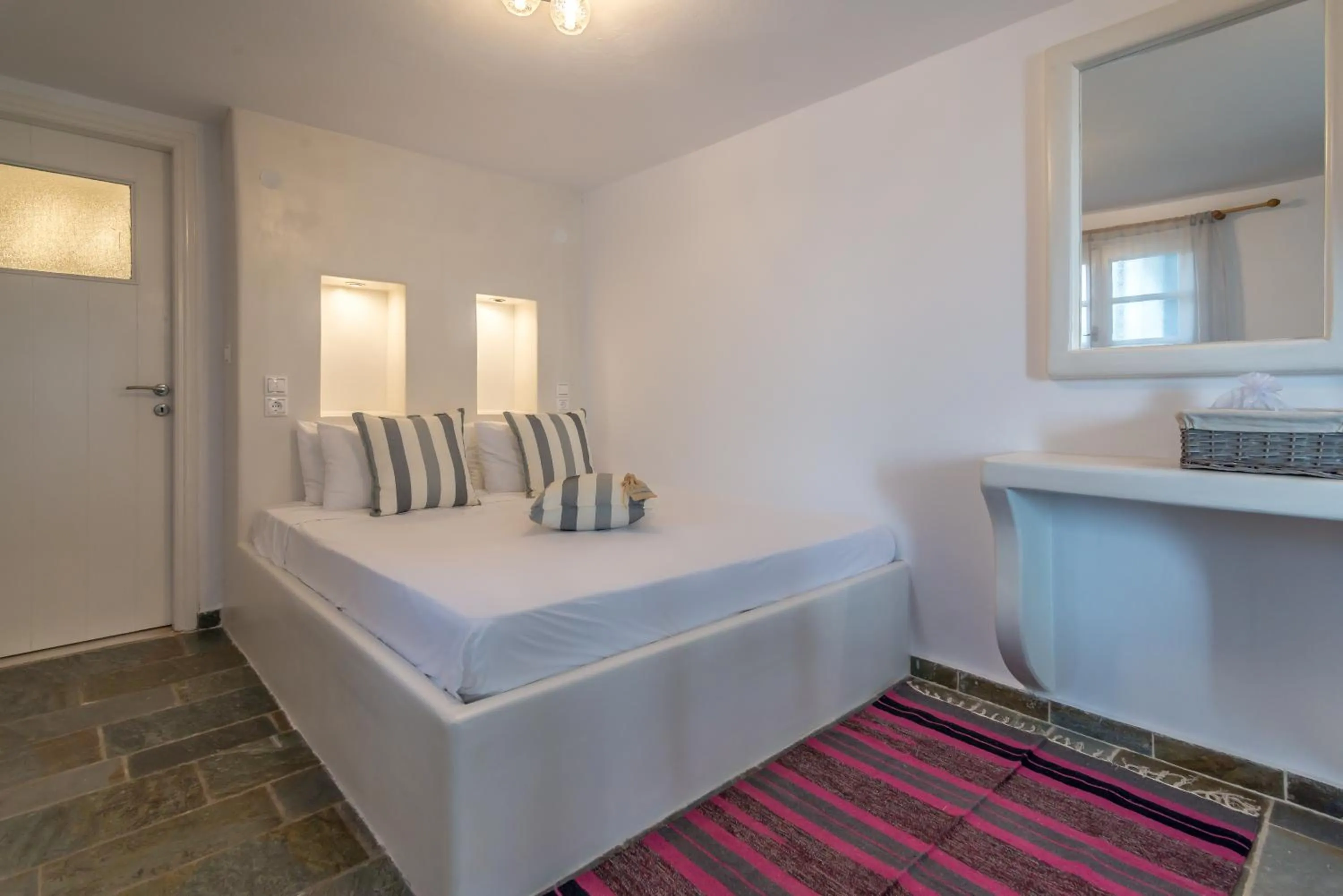 Bed in Eiriana Luxury Suites