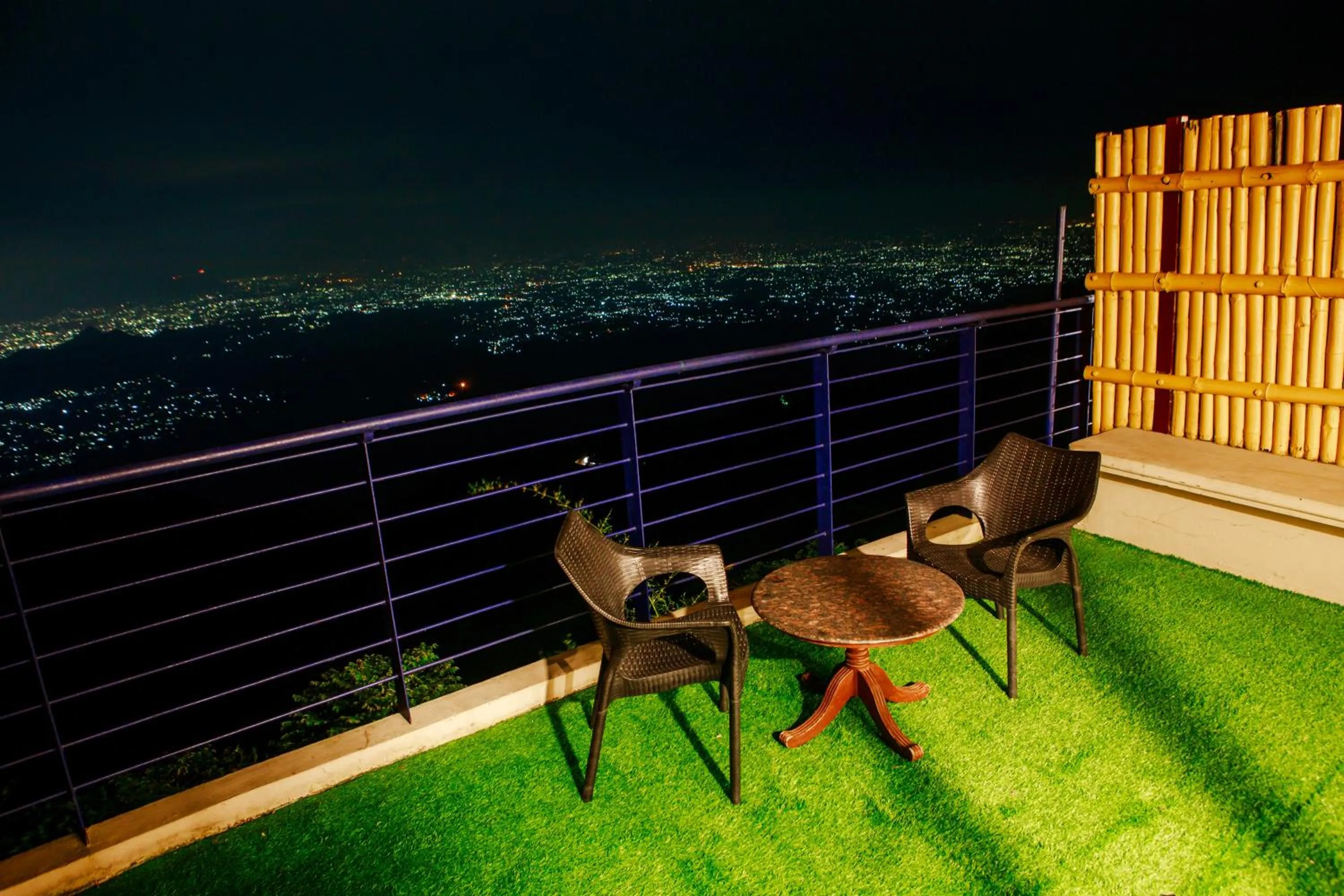 Seating area in GReaT Trails Yercaud by GRT Hotels