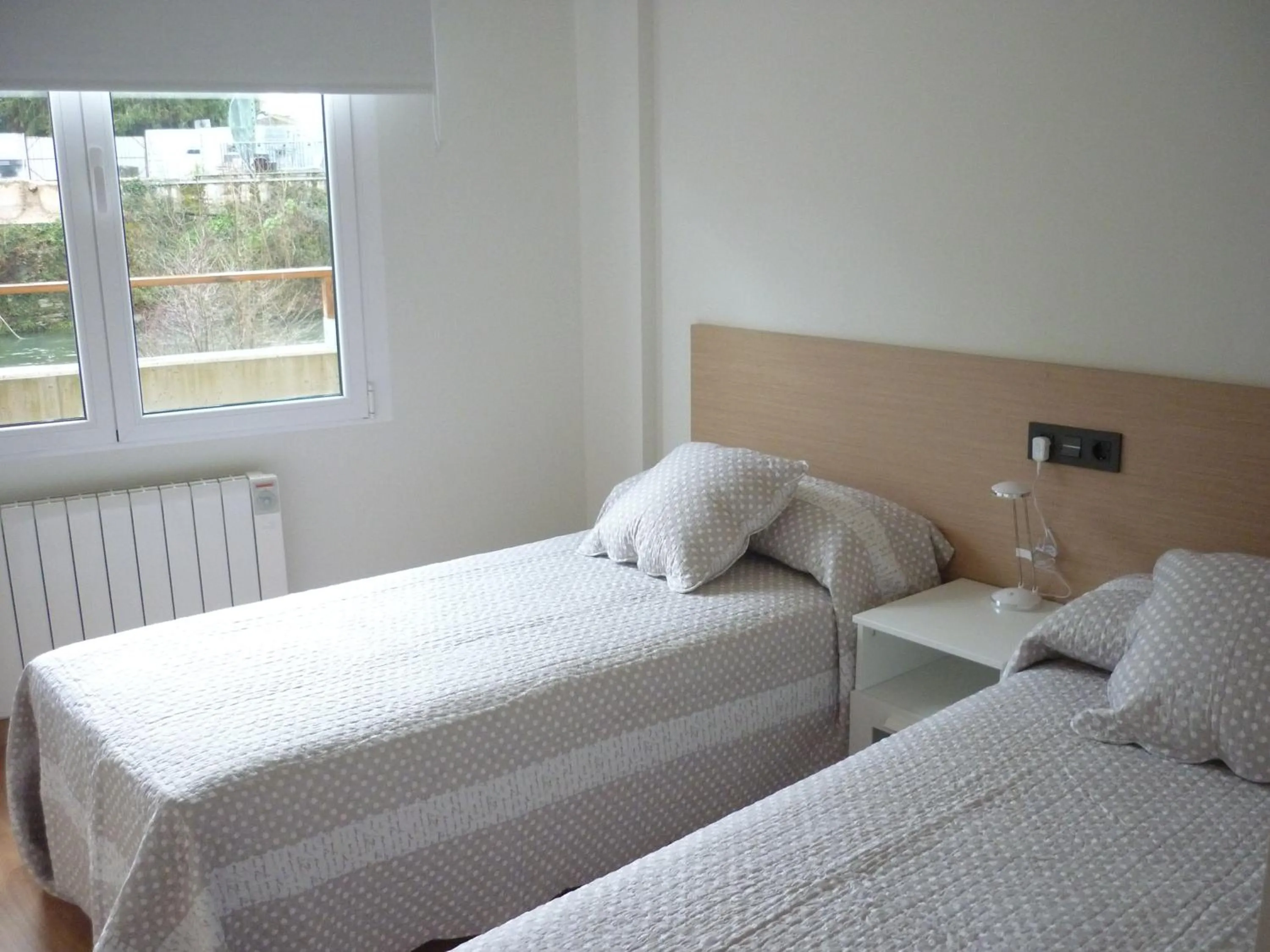 Bed in Pensión-Albergue Puente Ribeira