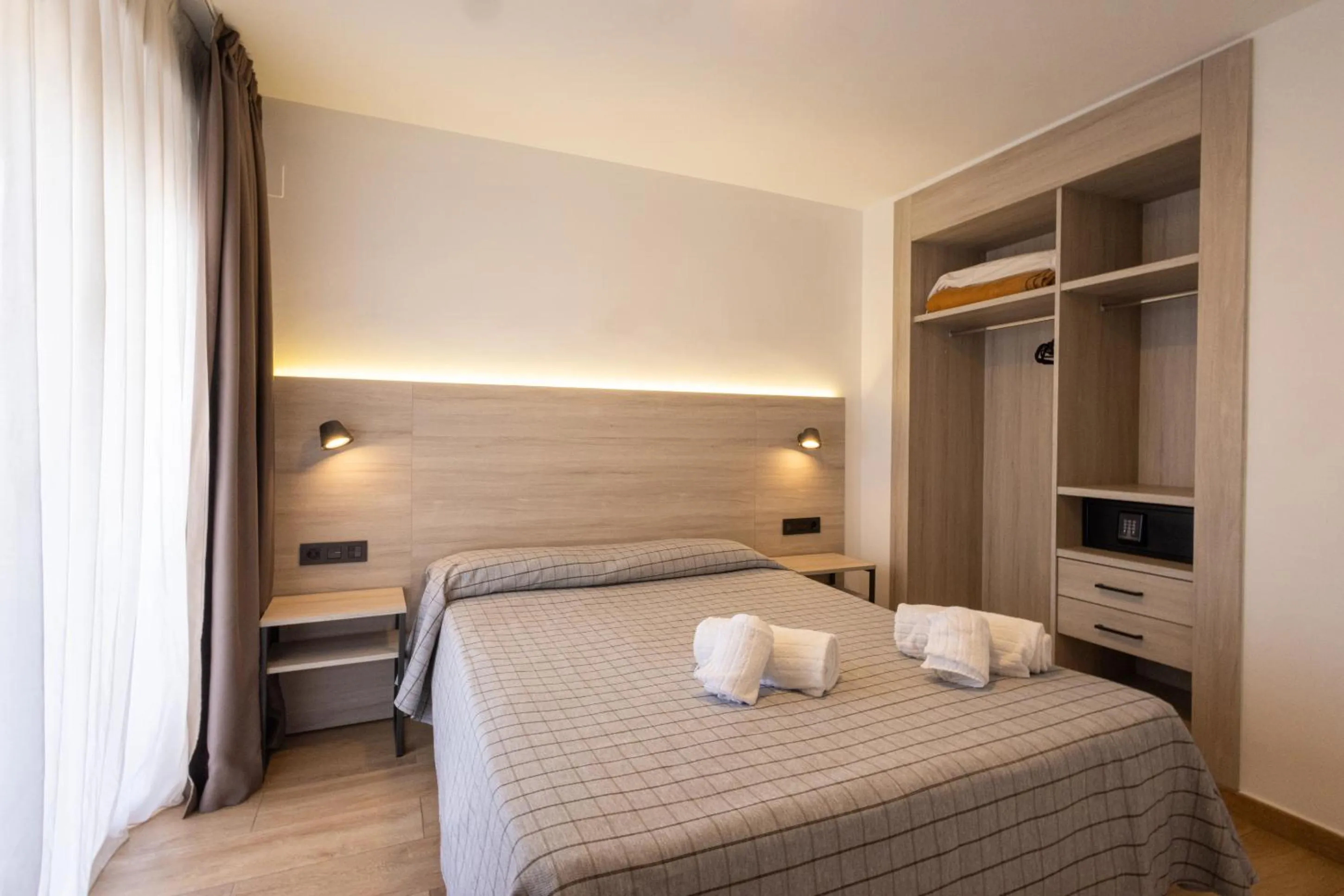 Bed in Apartamentos Odysea By Apartamentos Valentia