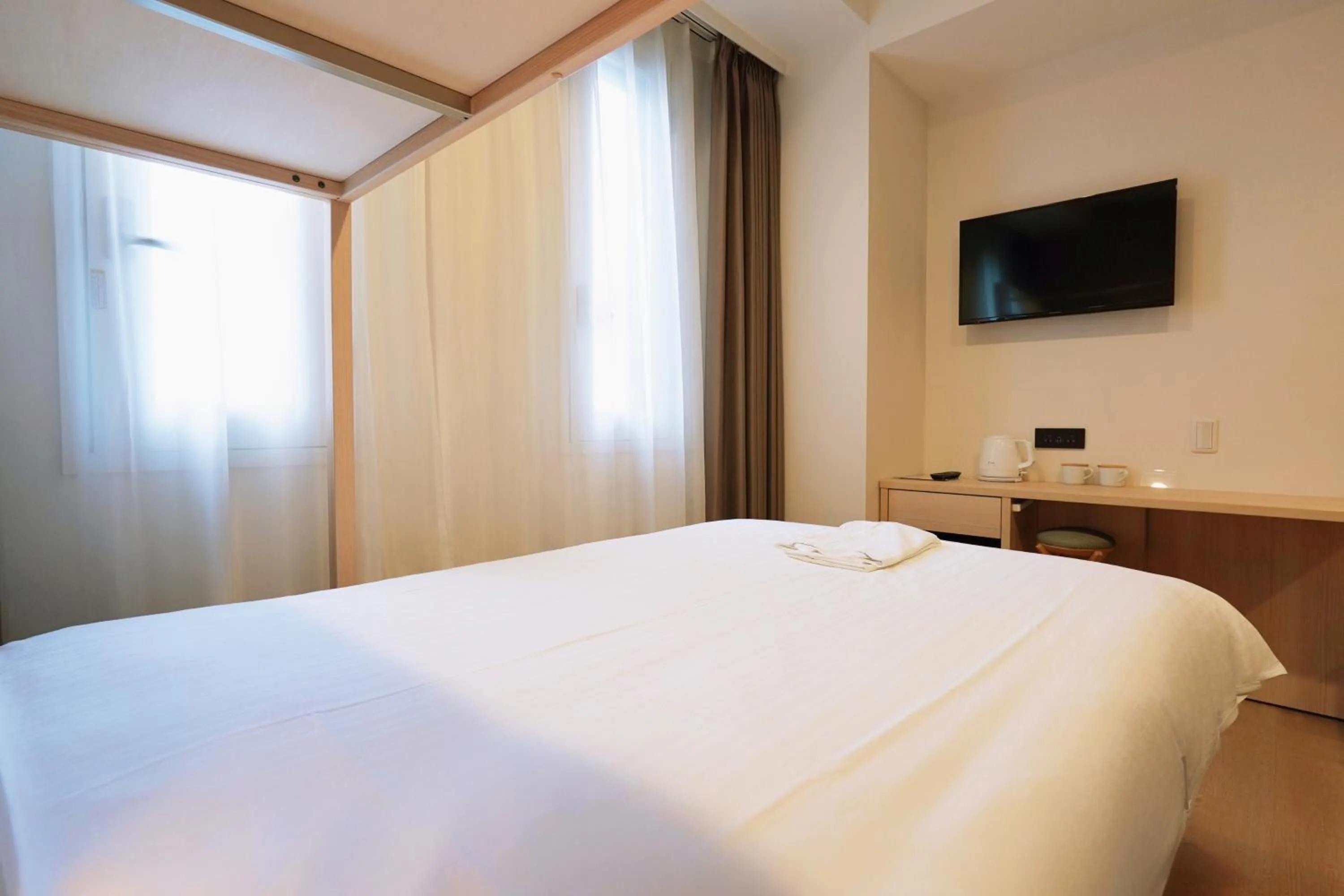 Bed in Park Central Sakura Hotel