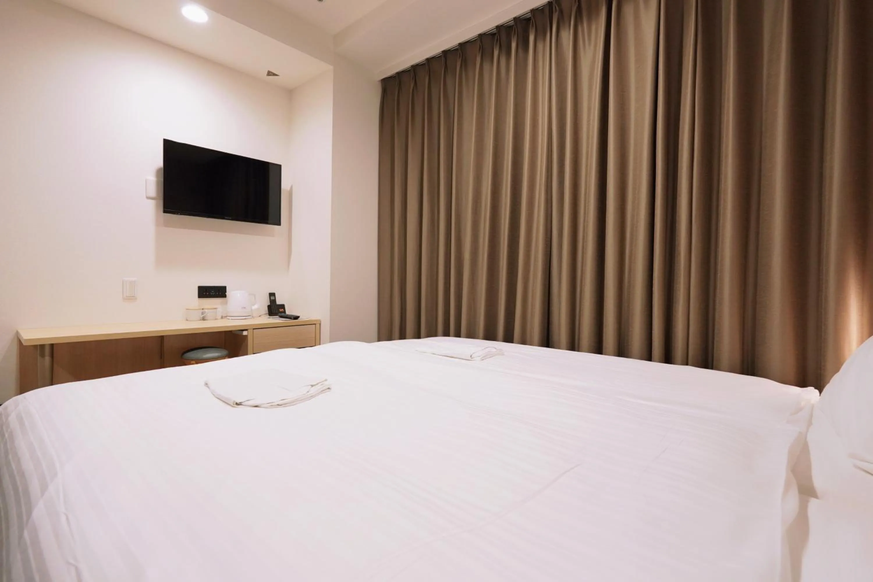 Bed in Park Central Sakura Hotel