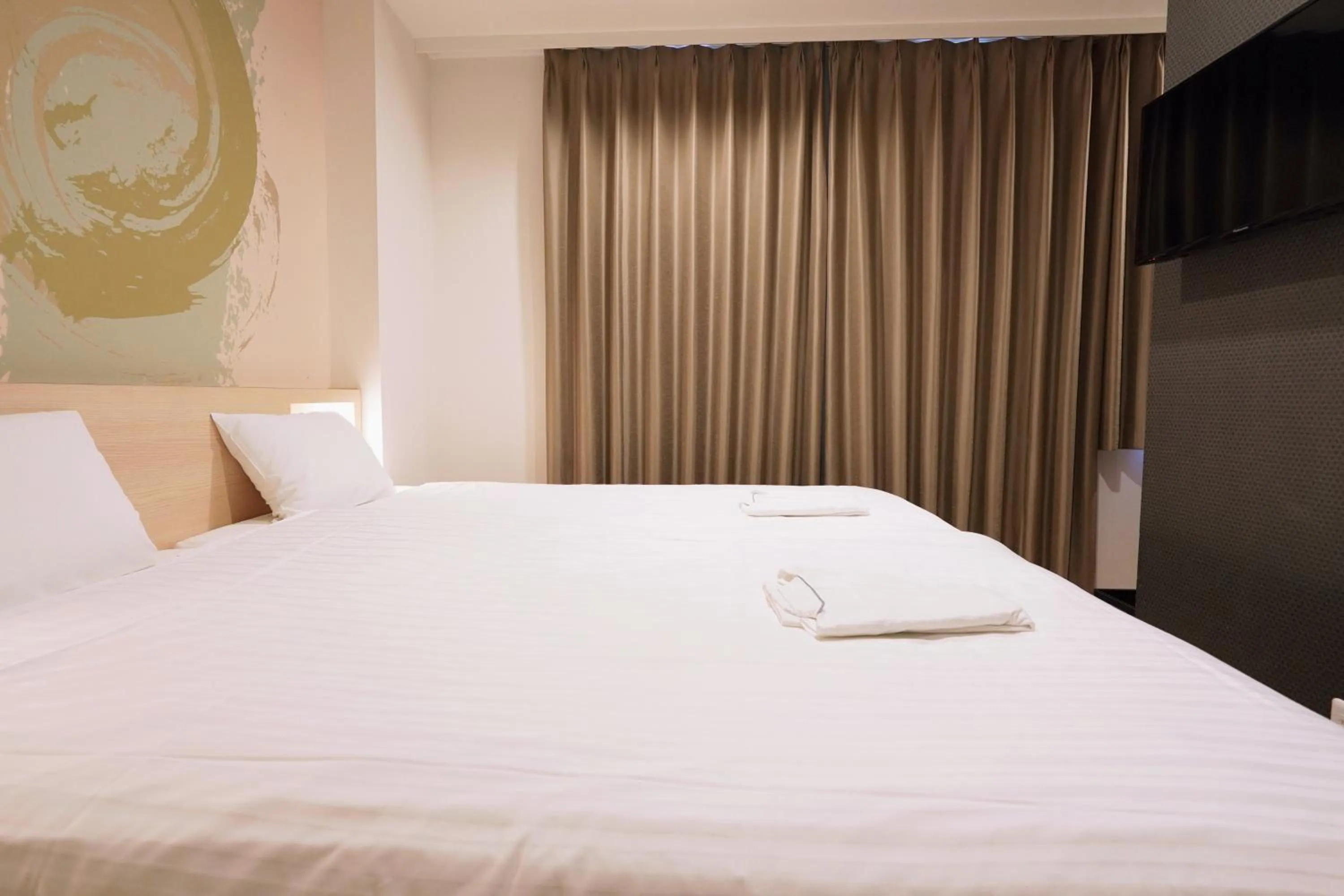 Bed in Park Central Sakura Hotel