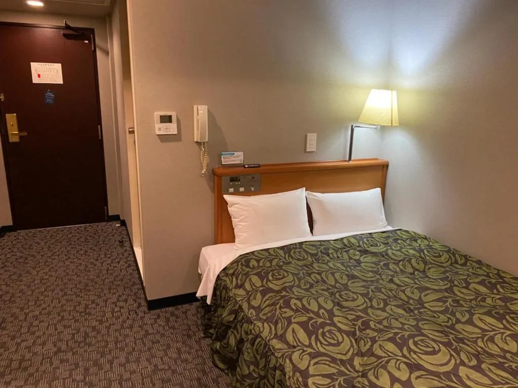 Bed in Hotel Sunrise21