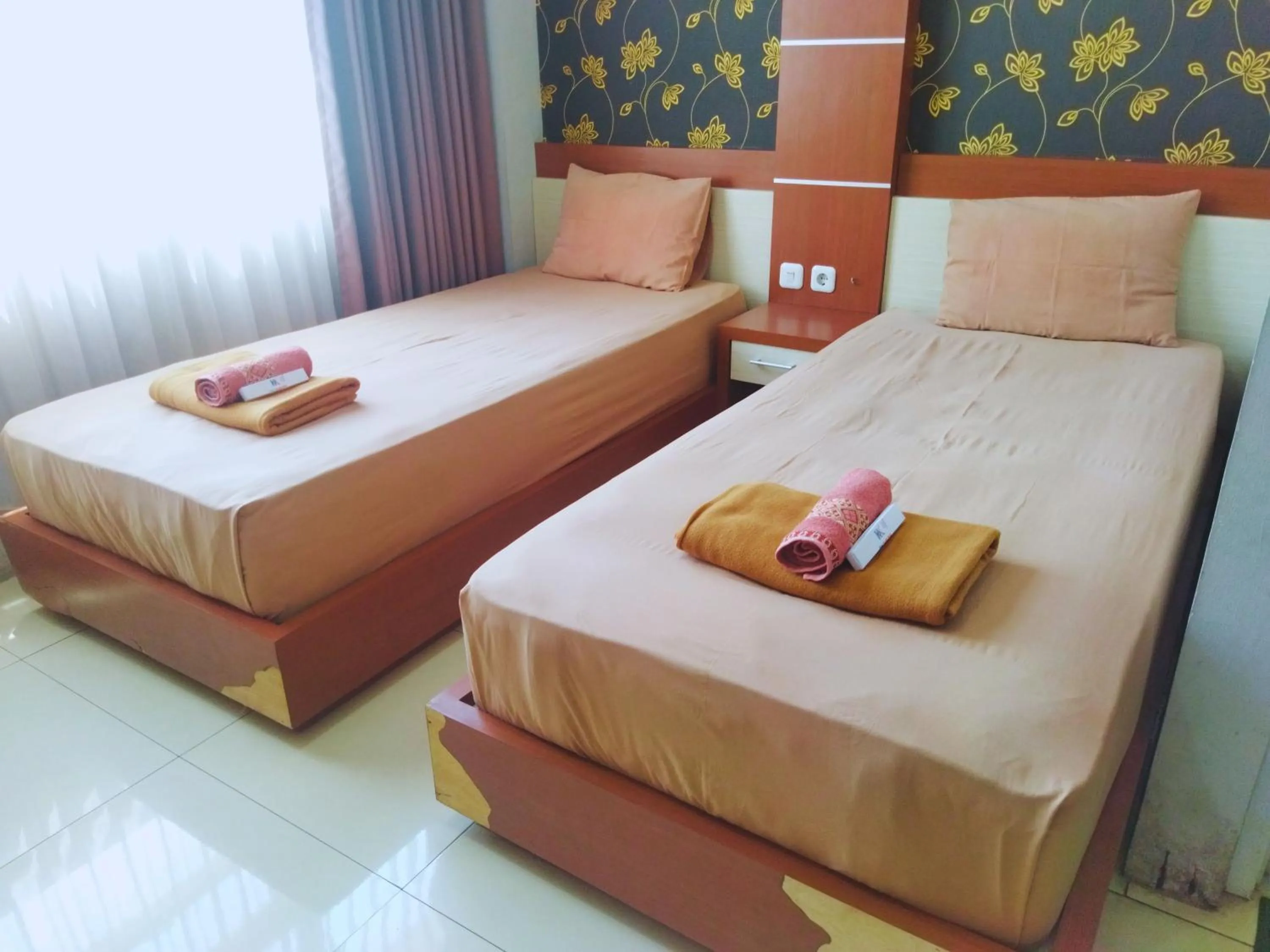Bed in Hotel Karunia PKPRI