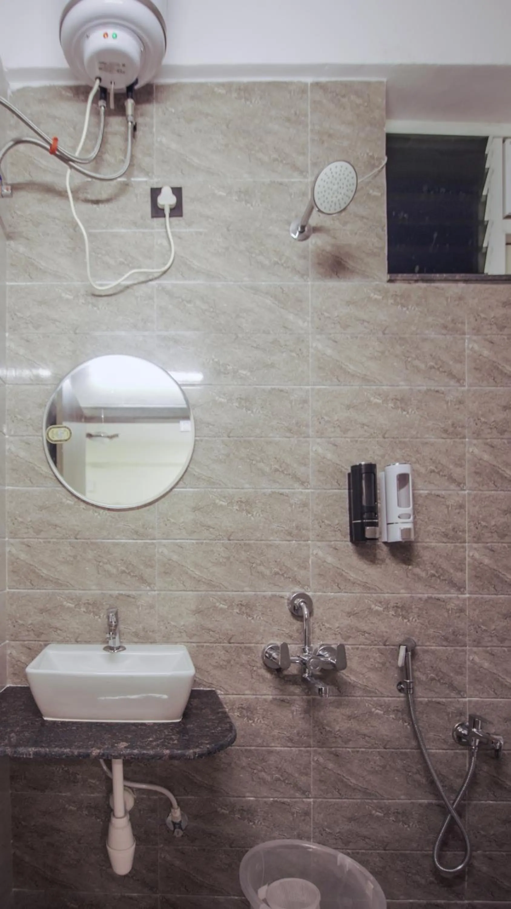 Shower in Radhe Suites